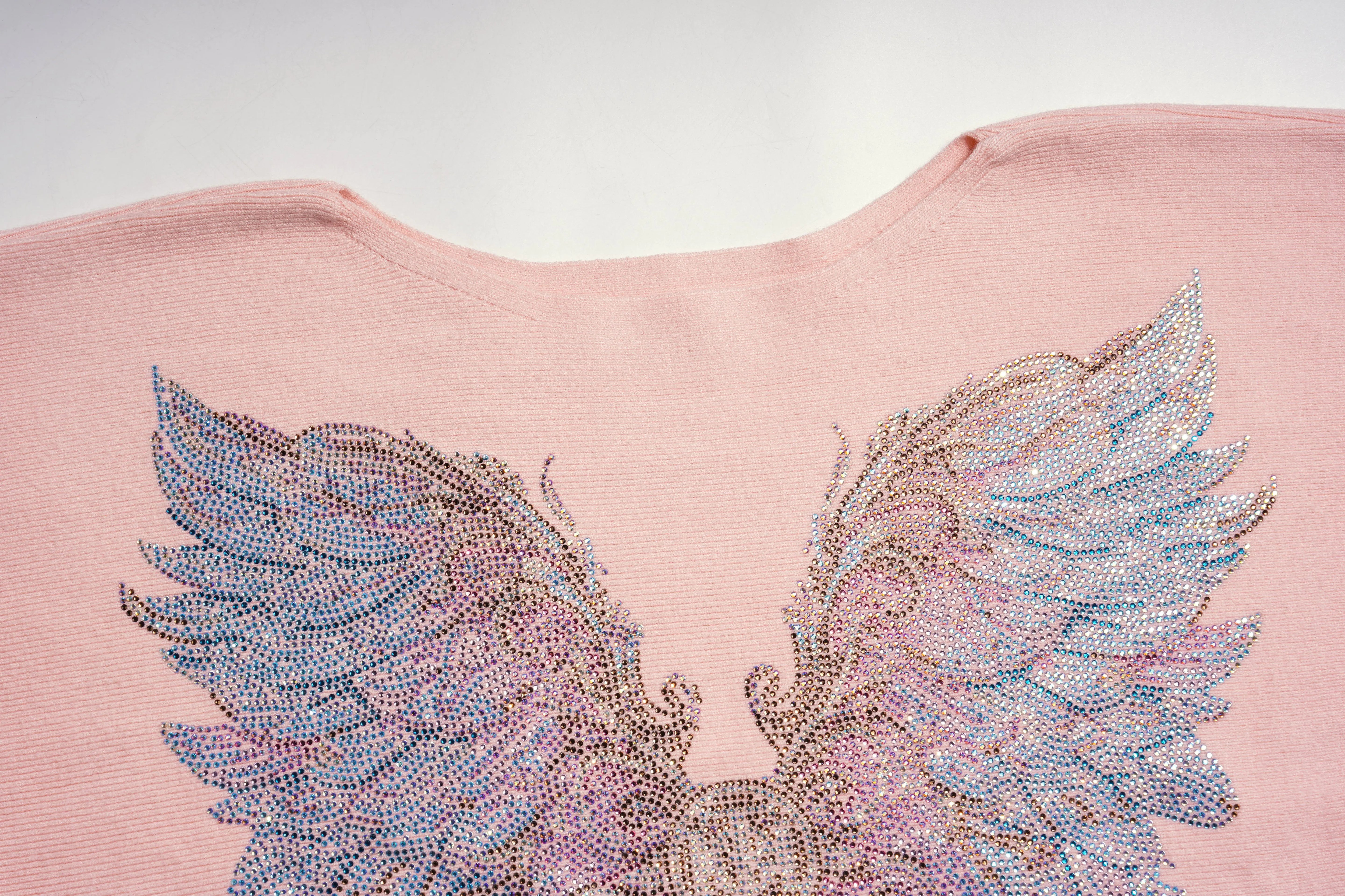 Pink top with sparkling angel wings design on a light gray background, TCH Rhinestone Angel Wings Layered Knit Top & Wide-Leg Pants Set