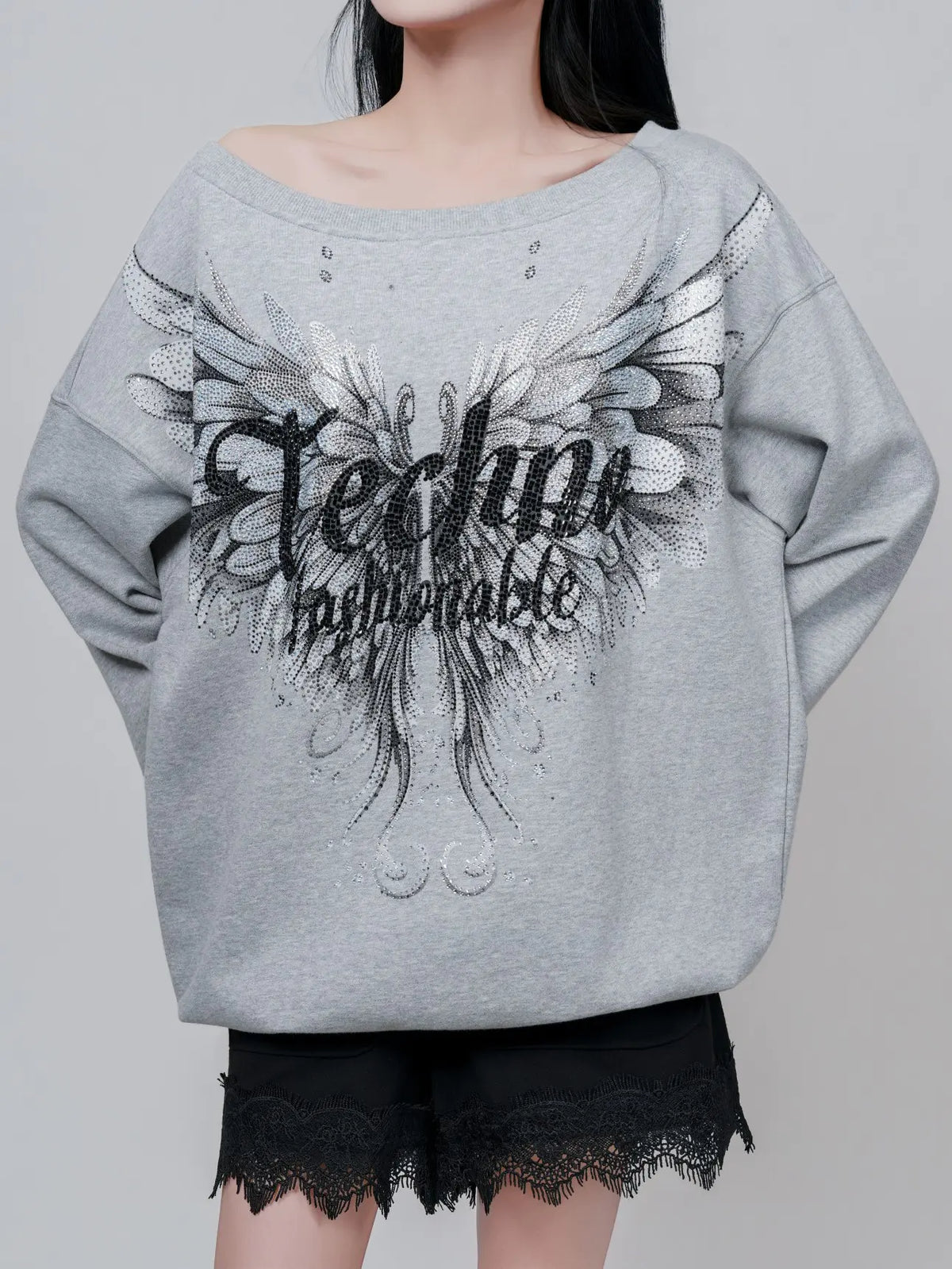 TCH Rhinestone Angel Wings Oversized Grey Sweatshirt TCH angel wings sweatshirt Grey rhinestone sweatshirt Oversized grey sweatshirt Angel wing graphic pullover Rhinestone embellished sweatshirt Black and white graphic sweatshirt Oversized streetwear sweatshirt Feather wing graphic top Y2K graphic sweatshirt Grey casual crewneck sweatshirt