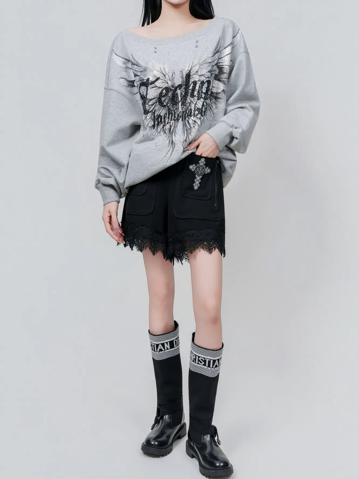 TCH Rhinestone Angel Wings Oversized Grey Sweatshirt TCH angel wings sweatshirt Grey rhinestone sweatshirt Oversized grey sweatshirt Angel wing graphic pullover Rhinestone embellished sweatshirt Black and white graphic sweatshirt Oversized streetwear sweatshirt Feather wing graphic top Y2K graphic sweatshirt Grey casual crewneck sweatshirt