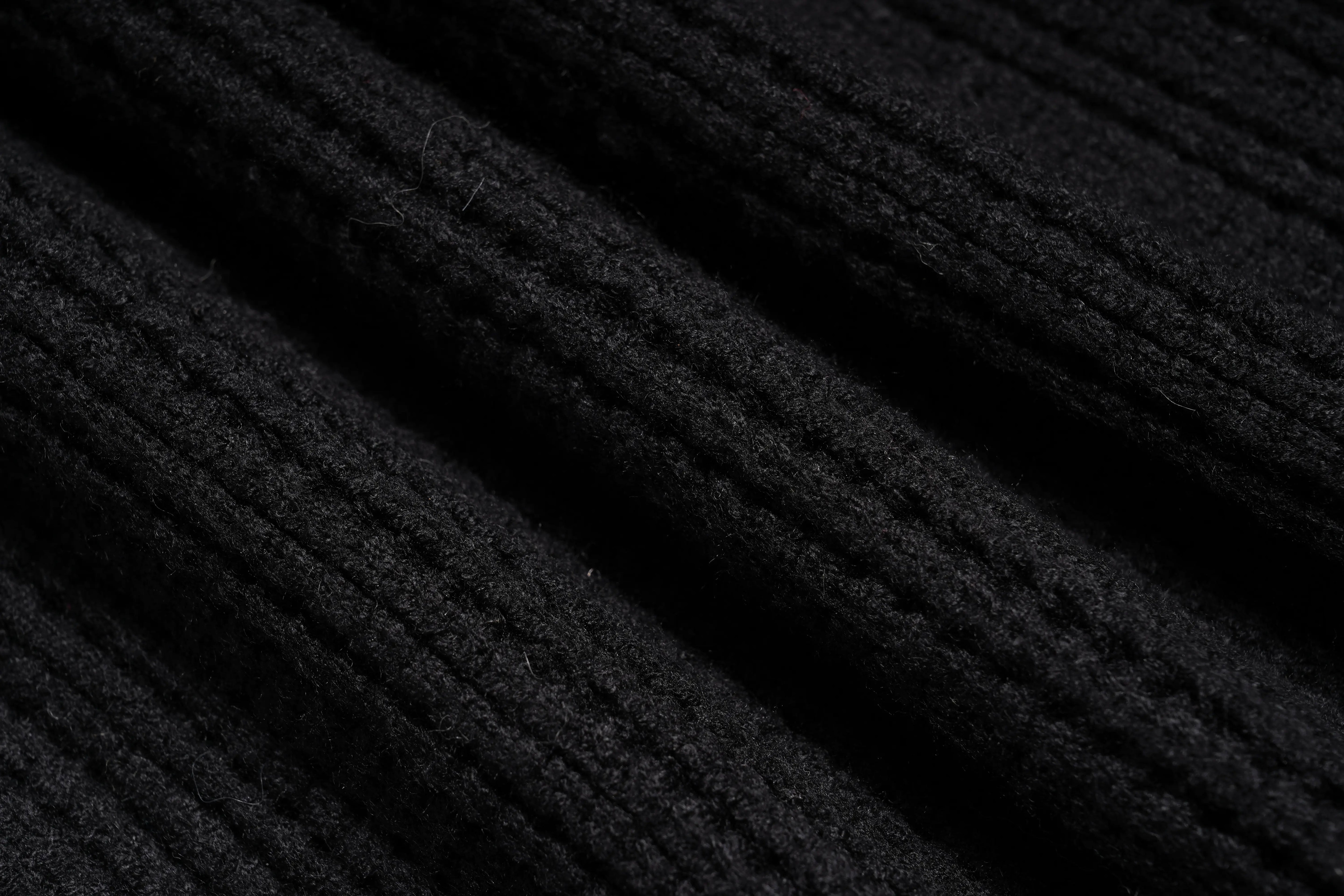 Close-up of black textured fabric, TCH Rhinestone Angel Wings Zip Hoodie & Flare Pants Set