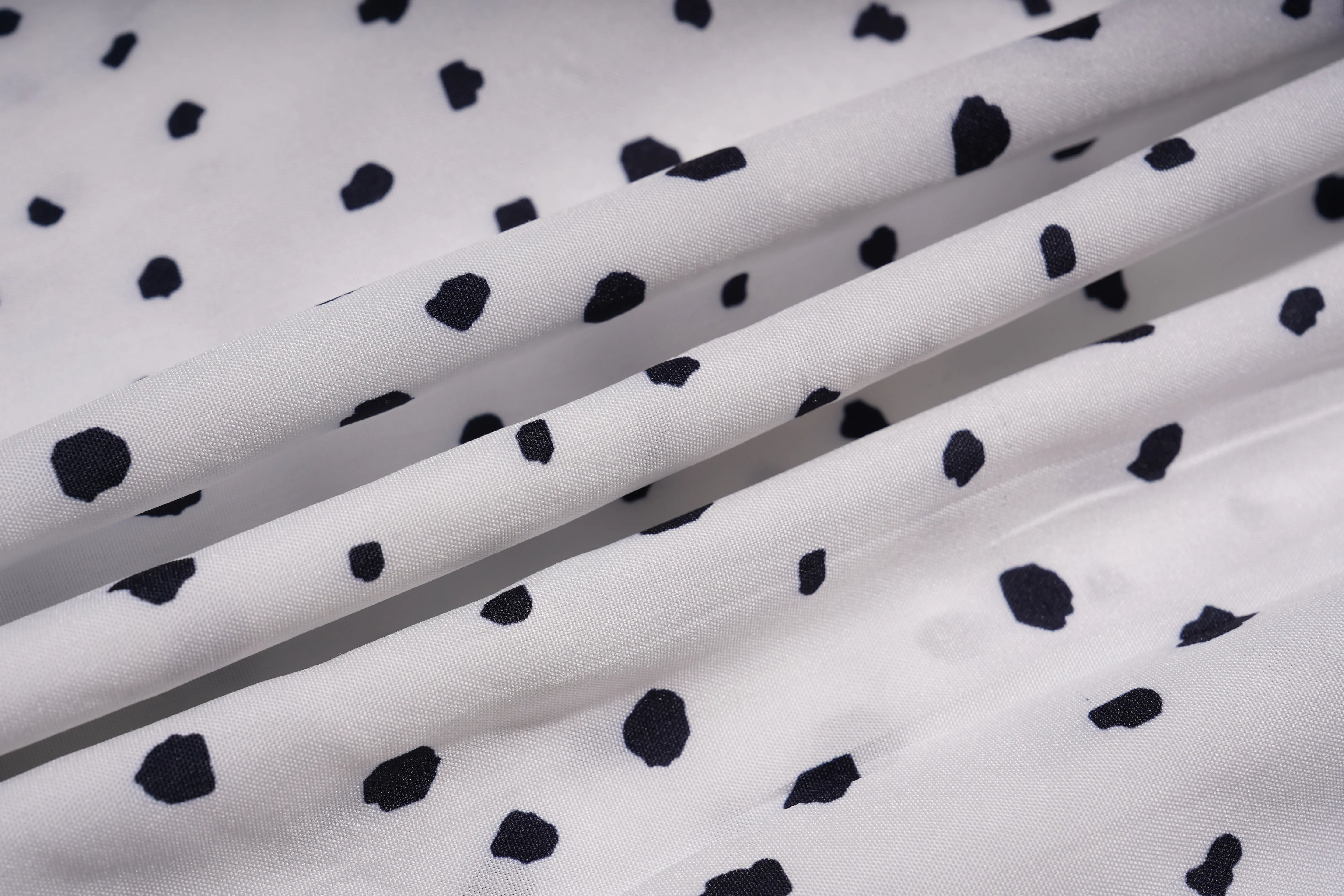 White fabric with black polka dots, TCH Rhinestone Animal Polka Dot Shirt