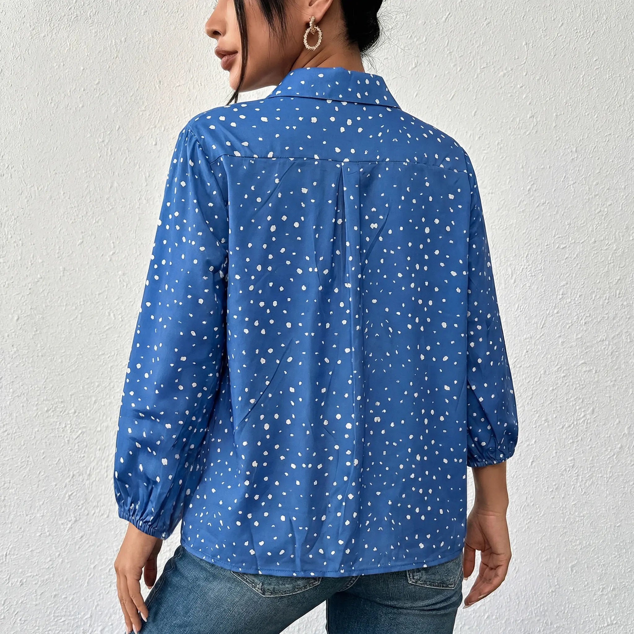 Person wearing a blue polka dot shirt against a white background, TCH Rhinestone Animal Polka Dot Shirt