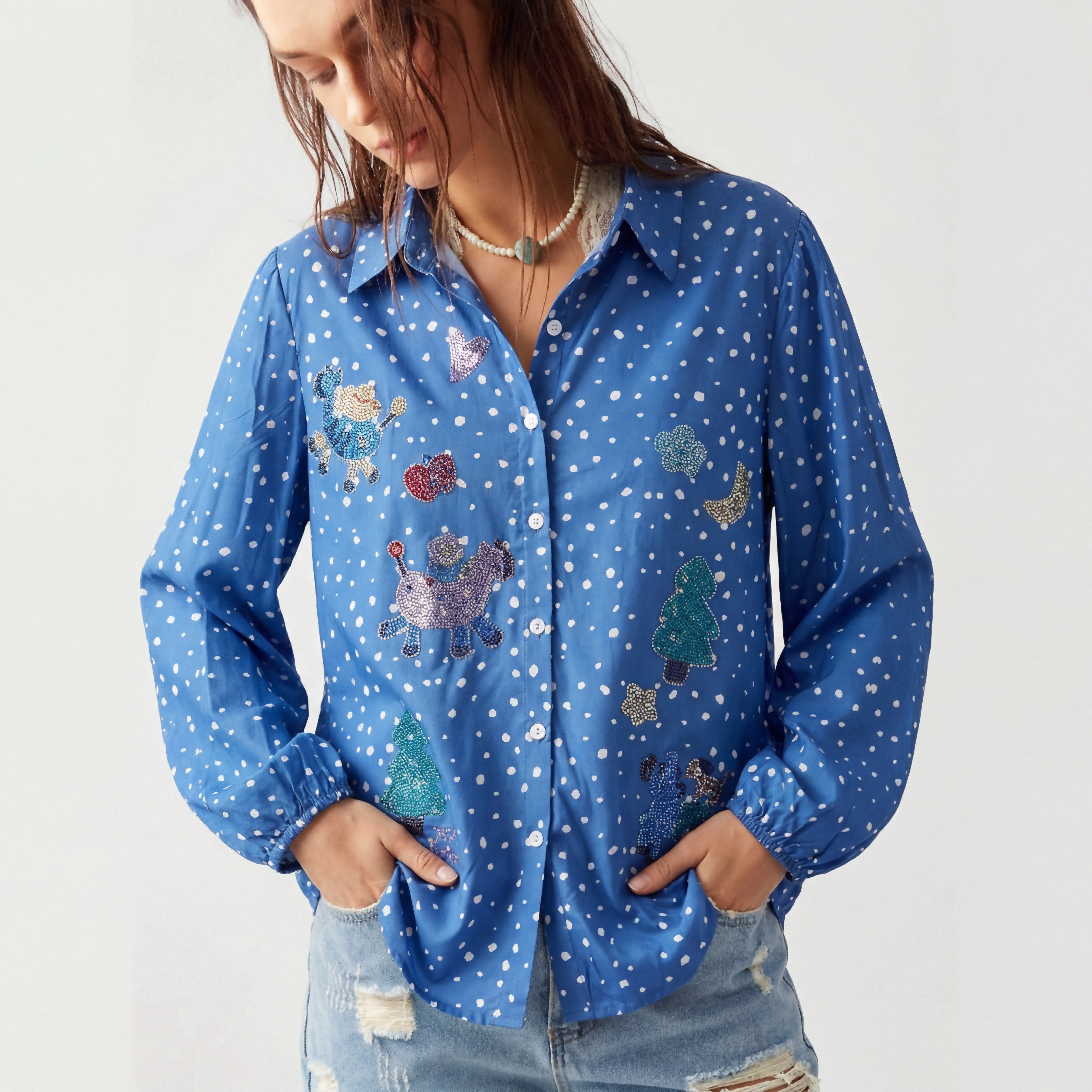 Woman wearing a blue shirt with colorful animal designs on a white background, TCH Rhinestone Animal Polka Dot Shirt