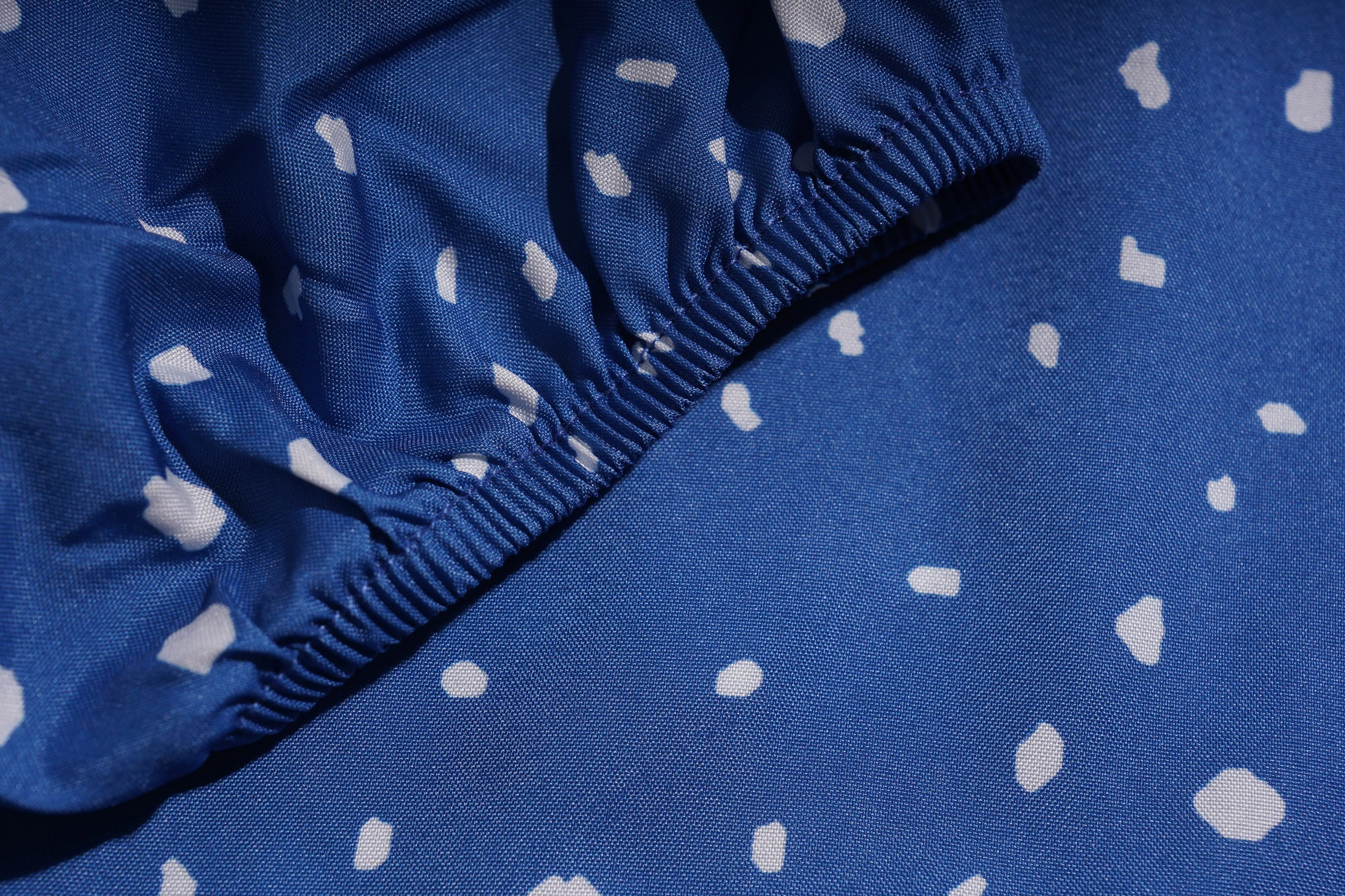 Close-up of blue fabric with white polka dots, TCH Rhinestone Animal Polka Dot Shirt