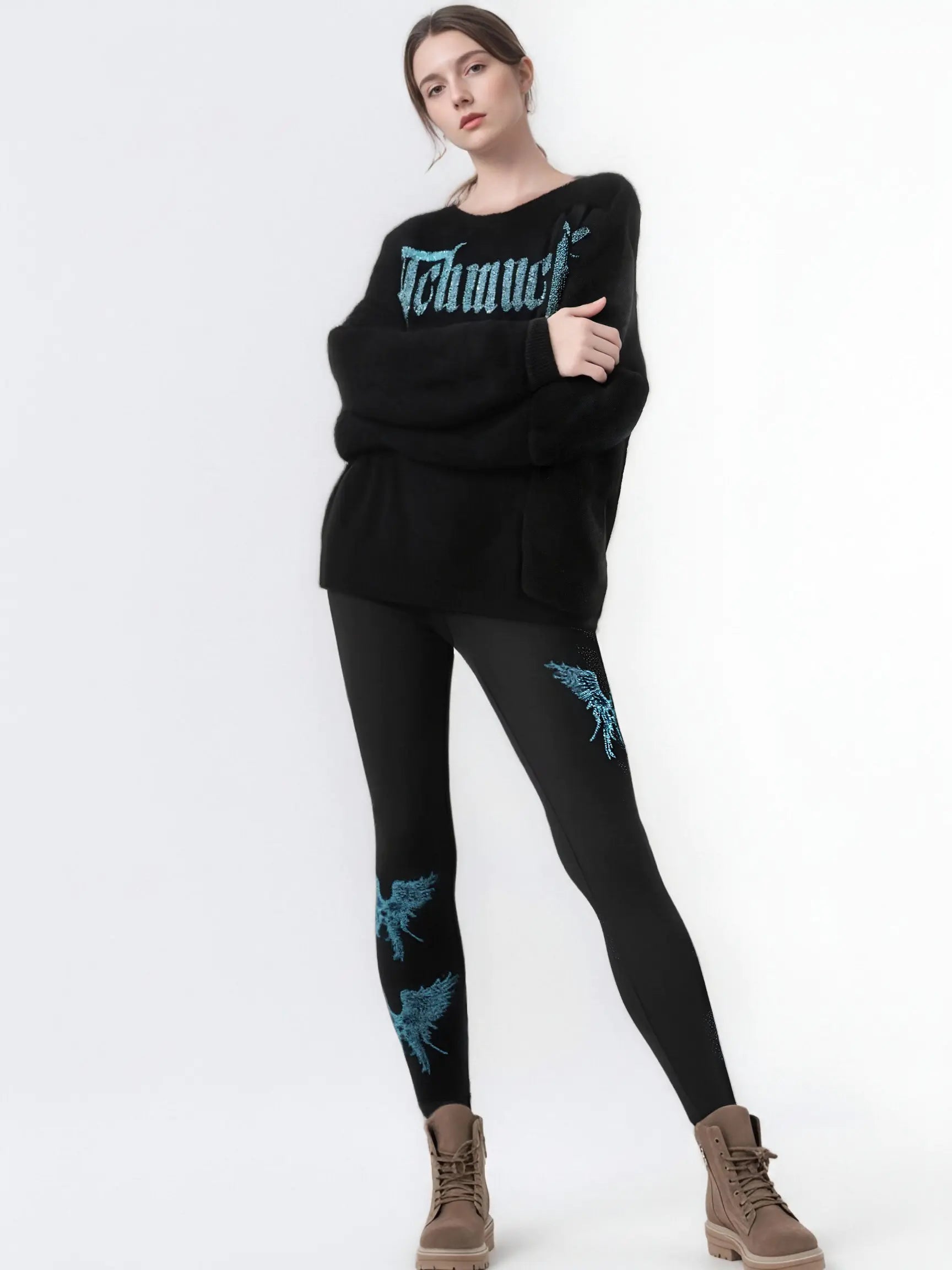 Person wearing a black sweater and leggings with blue designs on a white background, TCH Rhinestone Blue Wings Black High-Waist Leggings