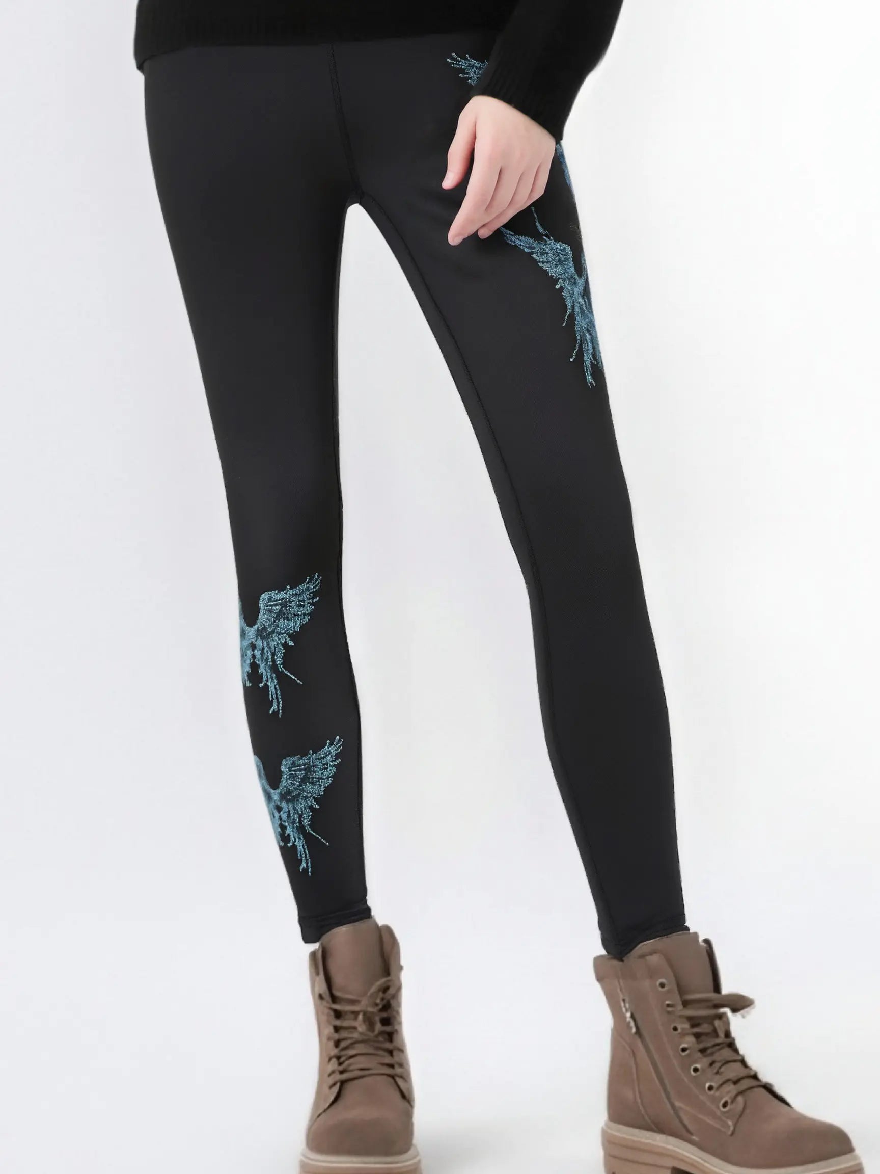 Black leggings with blue floral patterns worn by a person on a white background, TCH Rhinestone Blue Wings Black High-Waist Leggings