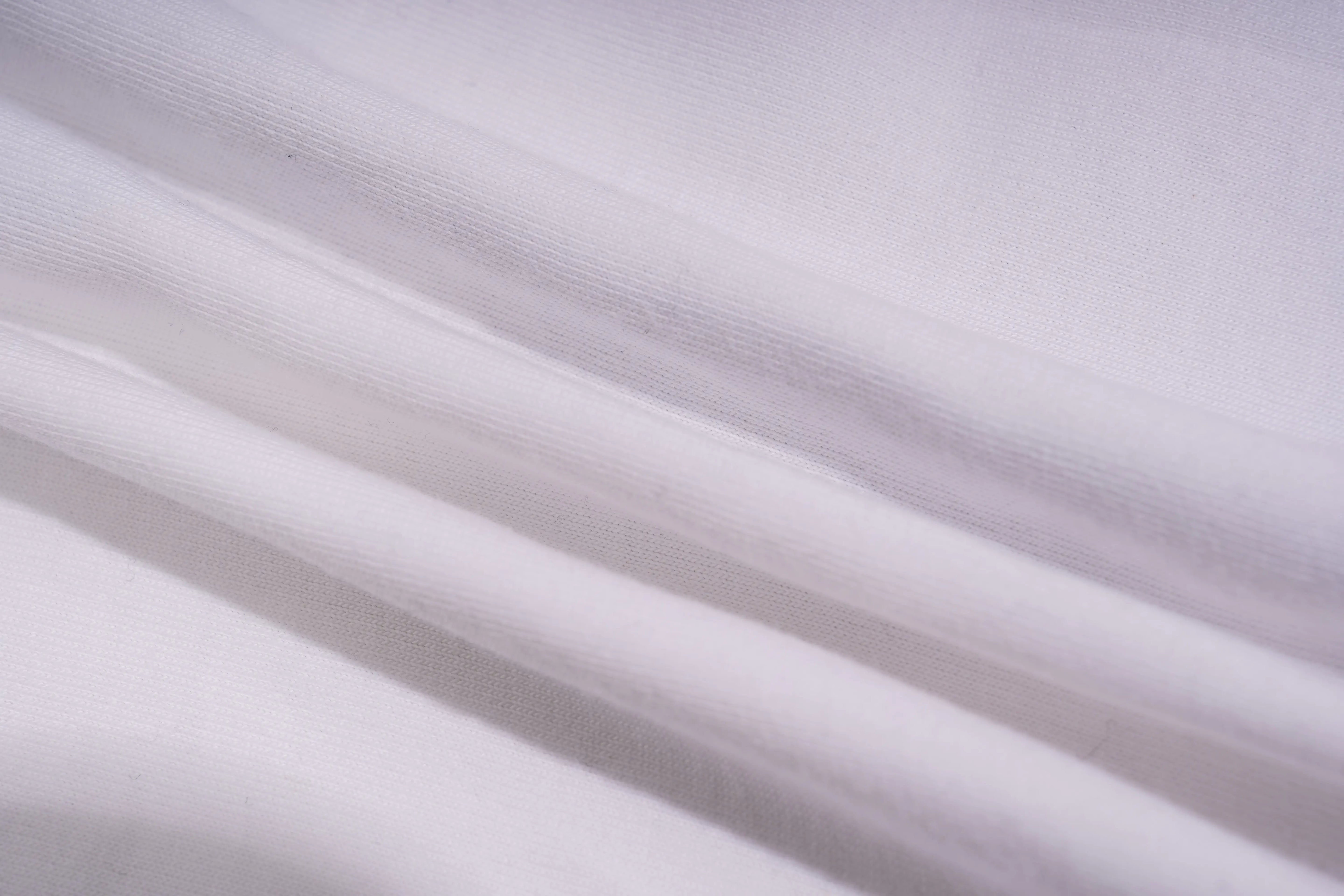 Close-up of light gray fabric with subtle texture, TCH Rhinestone Bow White T-Shirt