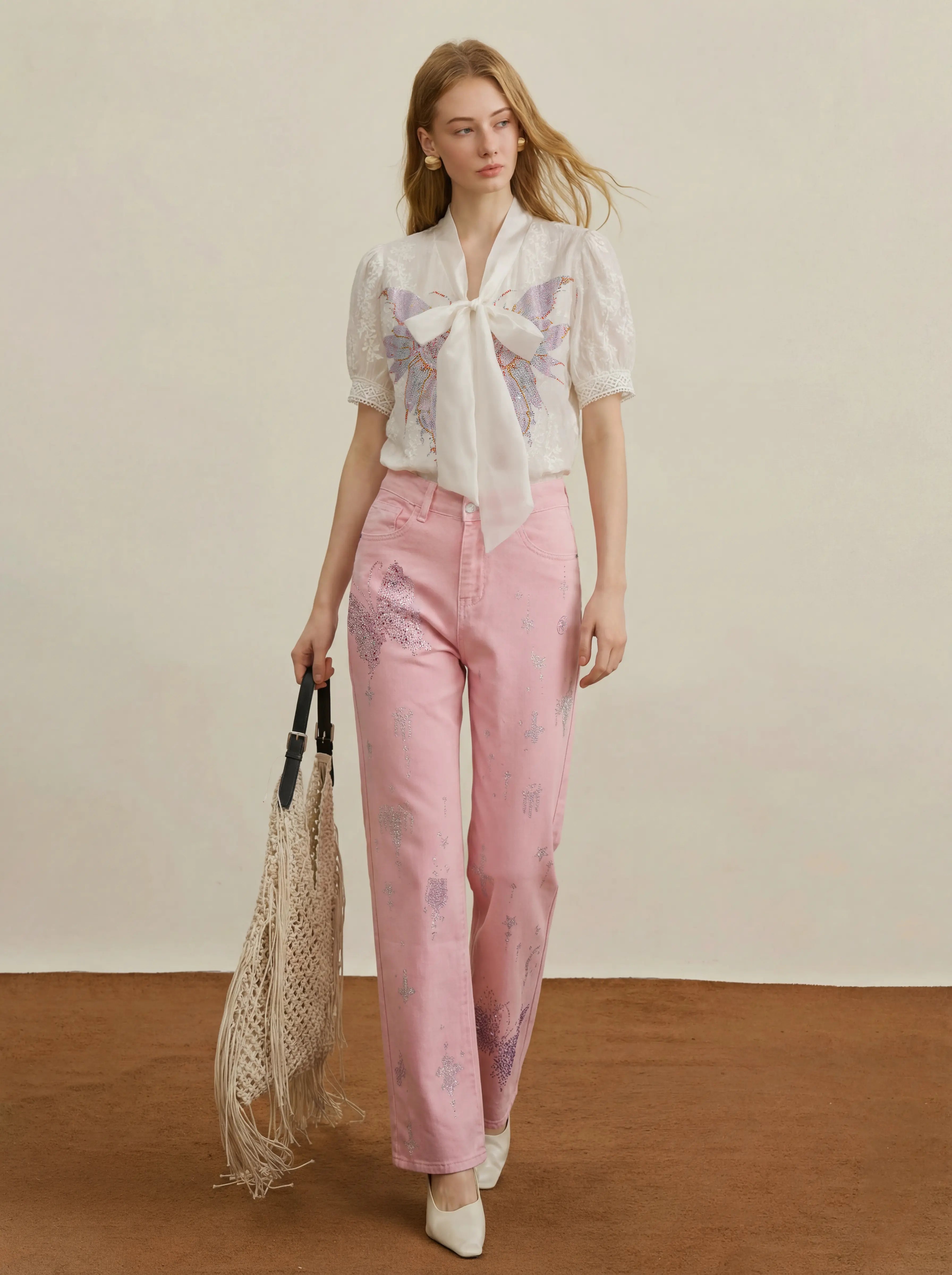 An off-white camisole crop top with thin spaghetti straps and delicate lace trim along the neckline and hem, shown against a plain white background. TCH Rhinestone Butterfly Bow Lace Blouse