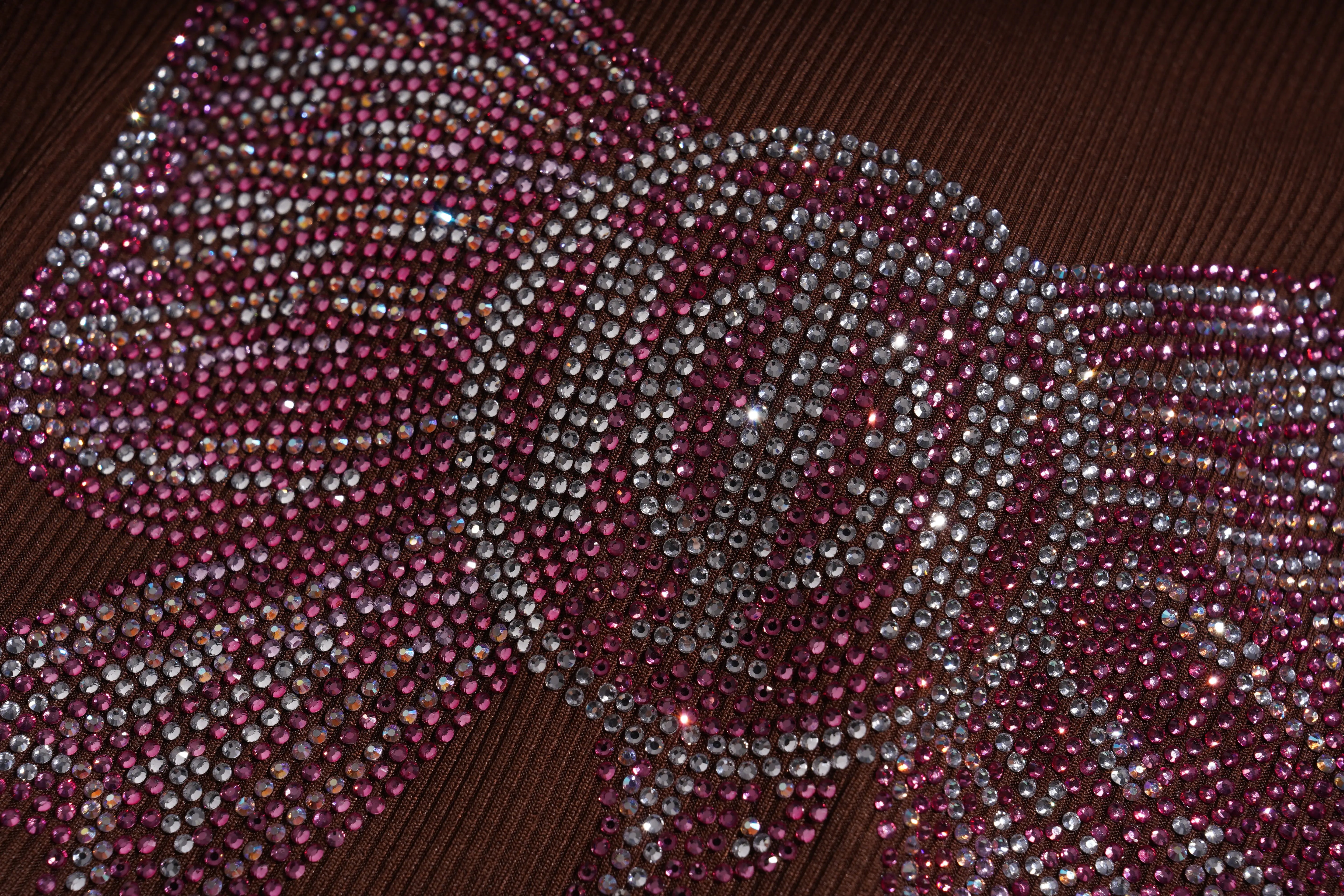 Close-up of a decorative bow with pink and silver beads on a brown background, TCH Rhinestone Butterfly Bow Tank Top