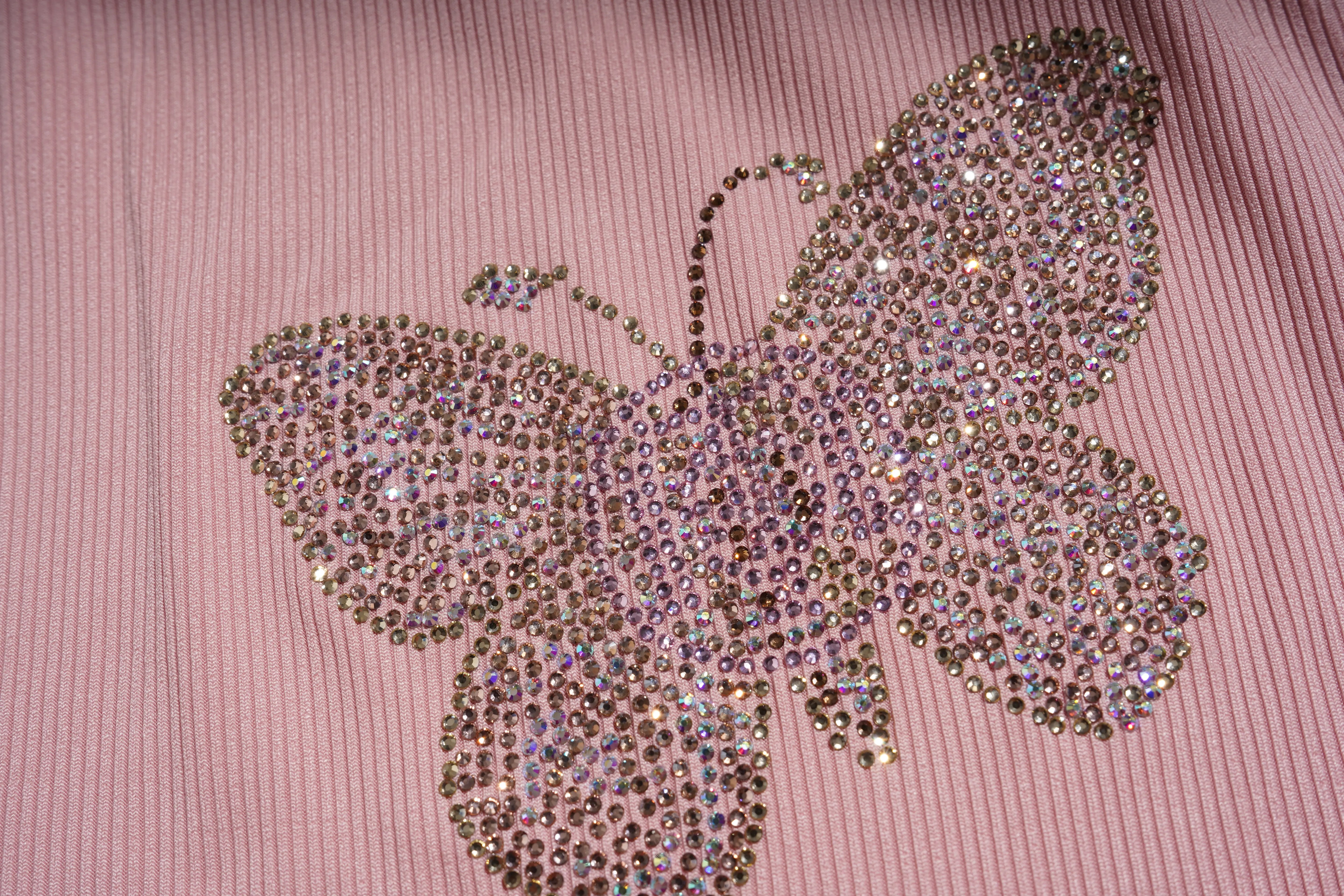 Butterfly design made of rhinestones on a pink fabric background, TCH Rhinestone Butterfly Bow Tank Top
