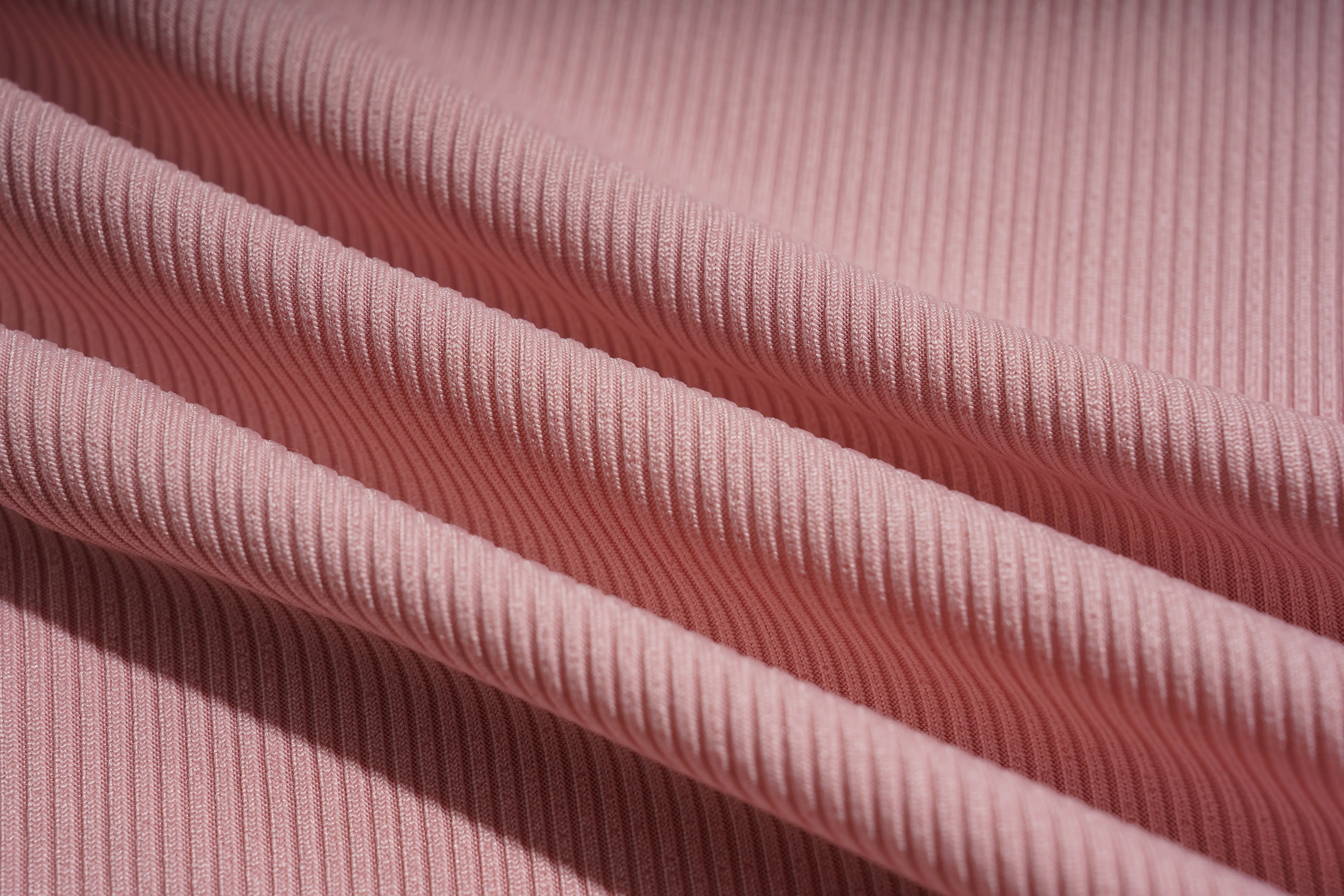 Close-up of pink ribbed fabric texture, TCH Rhinestone Butterfly Bow Tank Top