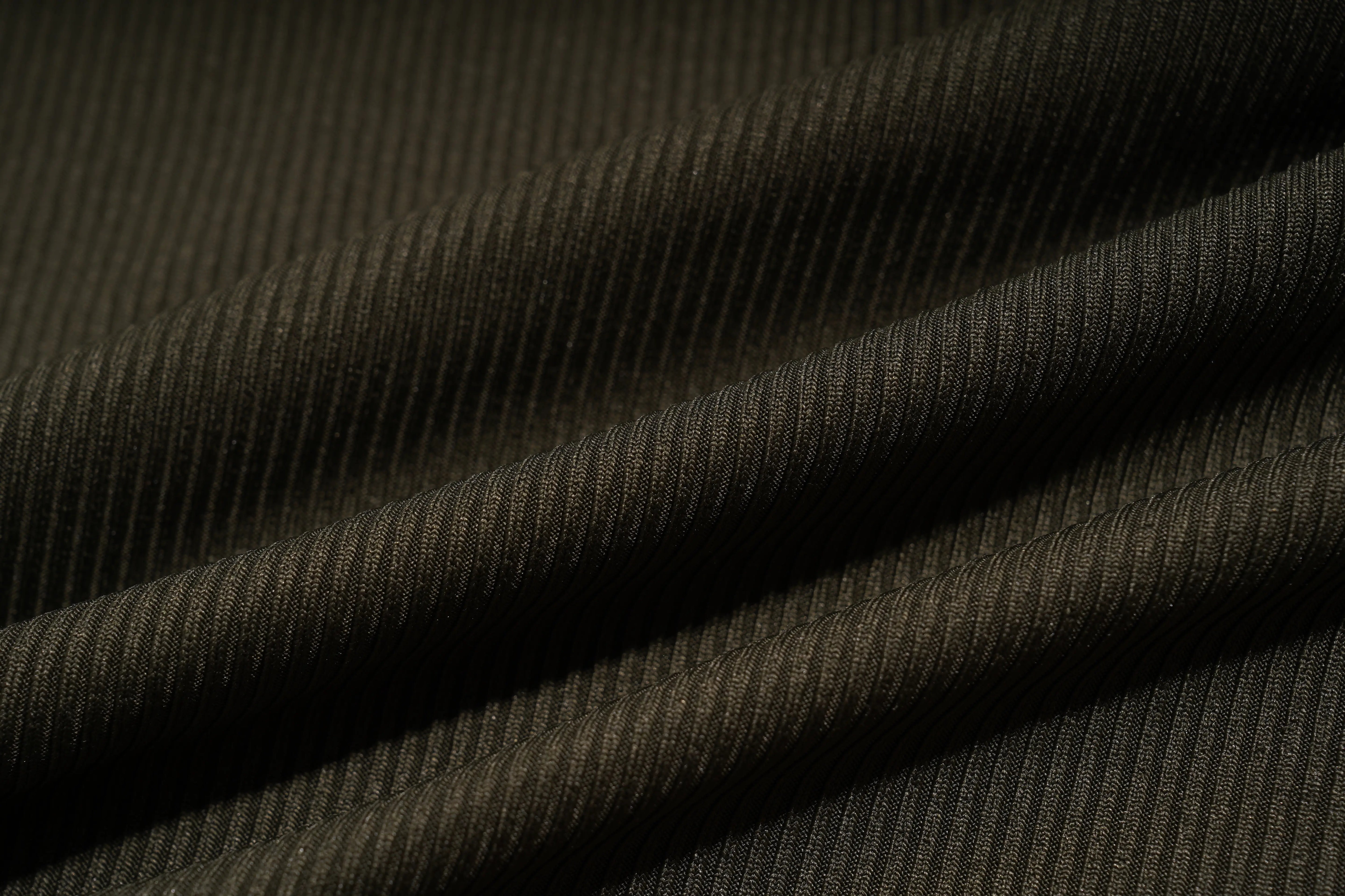Close-up of dark brown fabric with a subtle pattern, TCH Rhinestone Butterfly Bow Tank Top