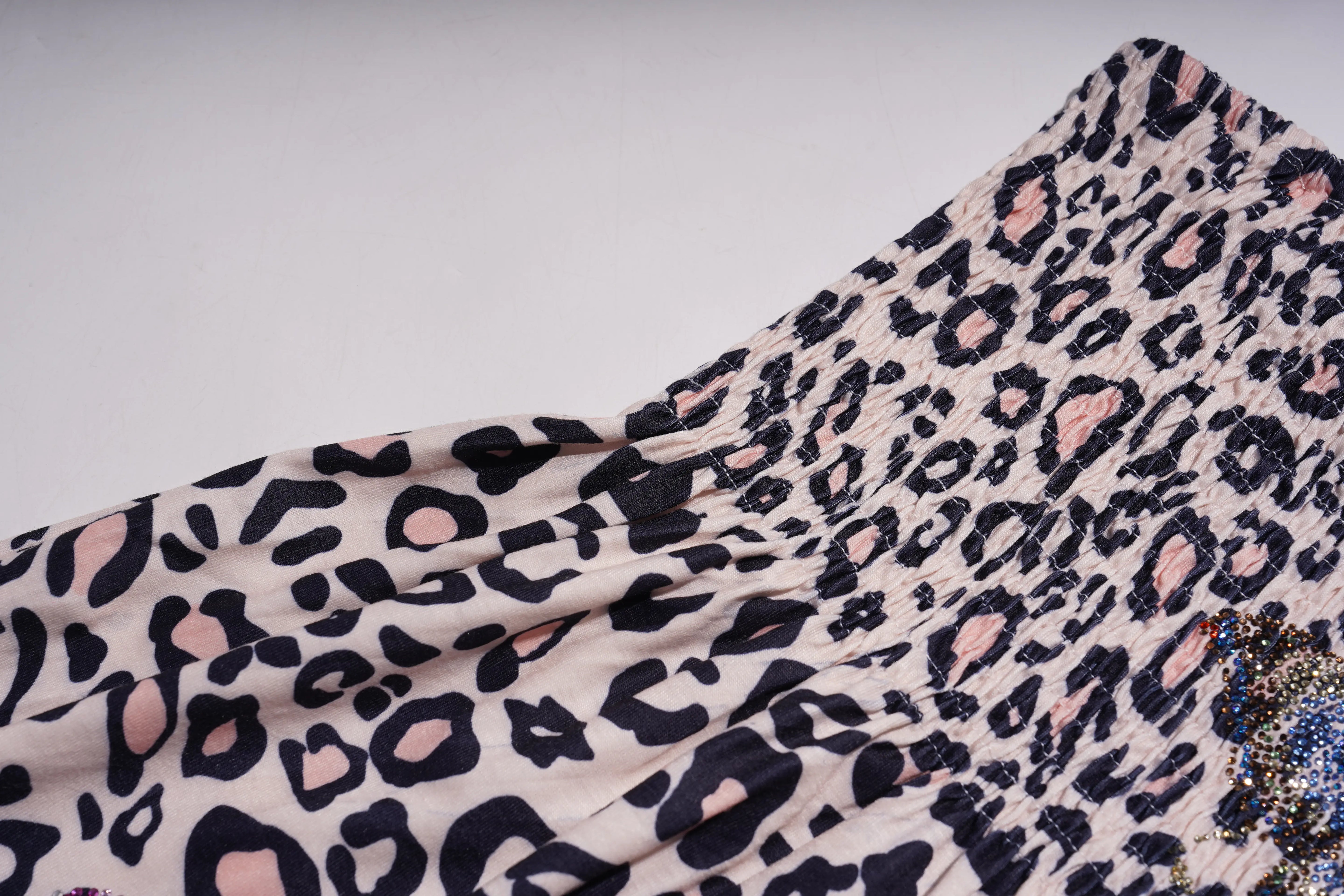Leopard print fabric with pink and black spots on a white background, TCH Rhinestone Butterfly & Floral Leopard Tube Top