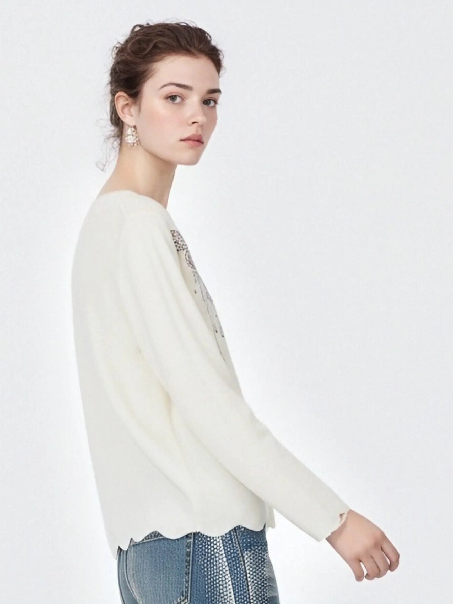 Woman wearing a white sweater with decorative elements on a plain background, TCH Rhinestone Butterfly Logo Knit Cardigan