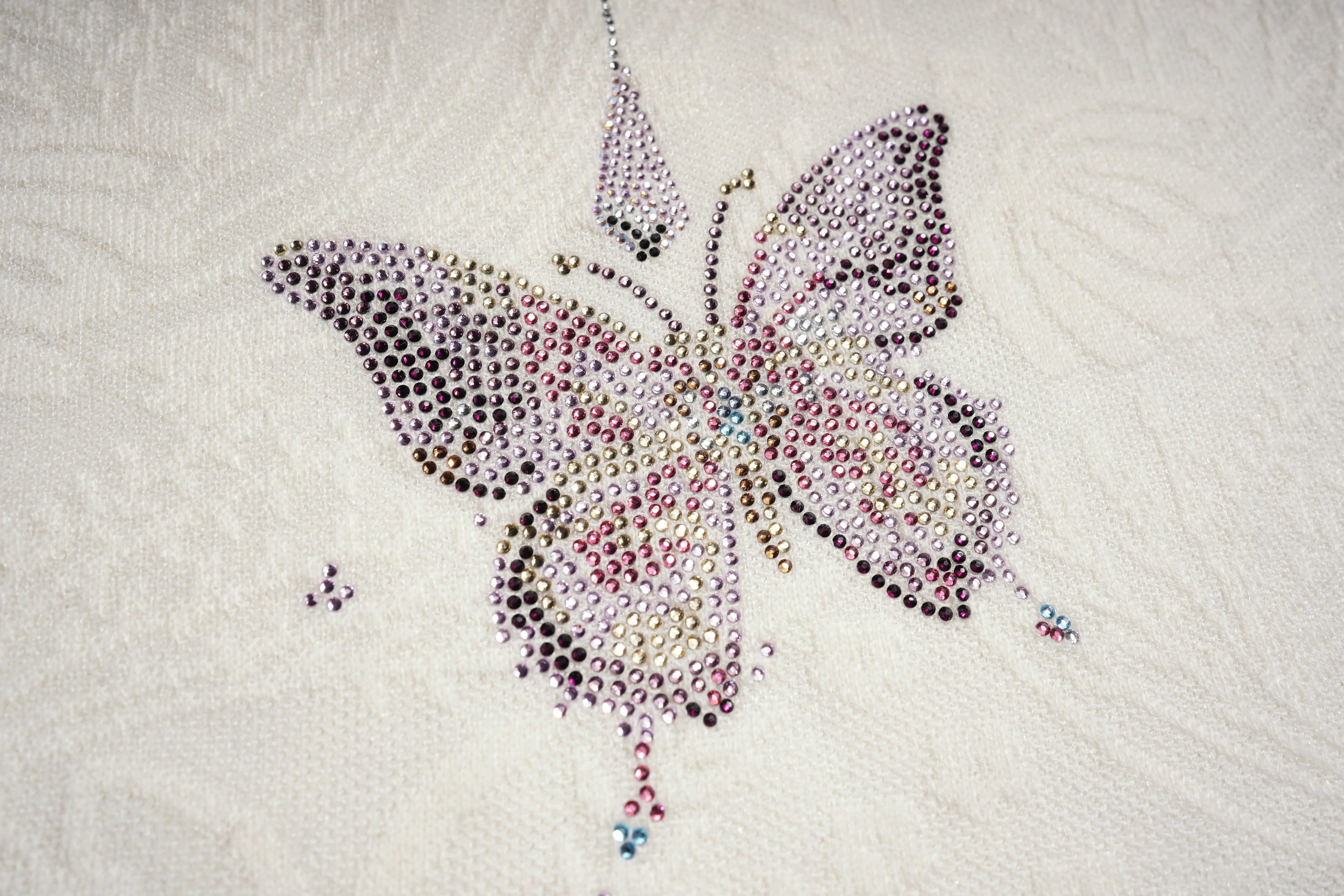 Butterfly design made of colorful beads on a textured white background, TCH Rhinestone Butterfly Logo Knit Cardigan