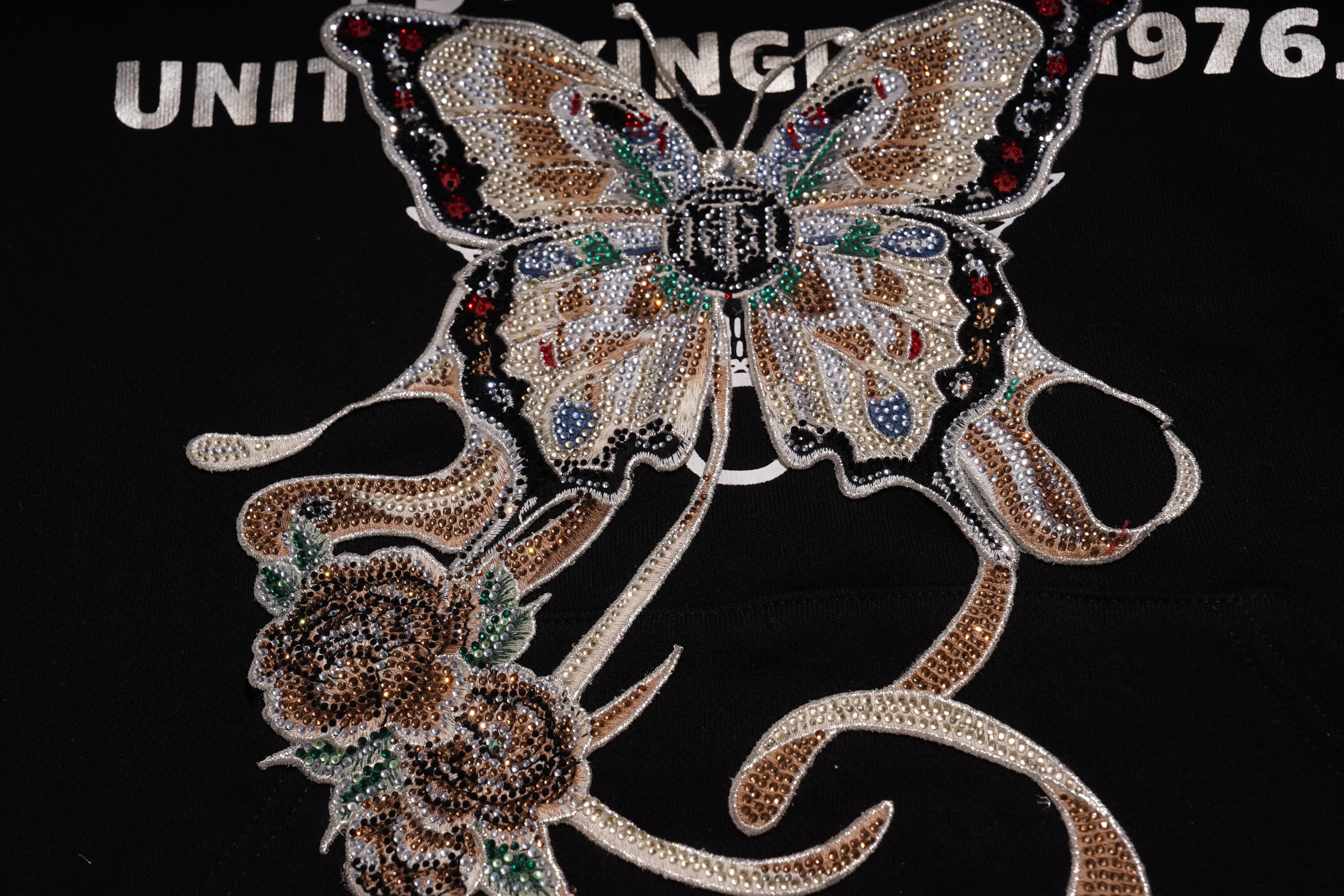 Decorative butterfly patch with rhinestones on a black background, TCH Rhinestone Butterfly & Peony Embroidered Hoodie