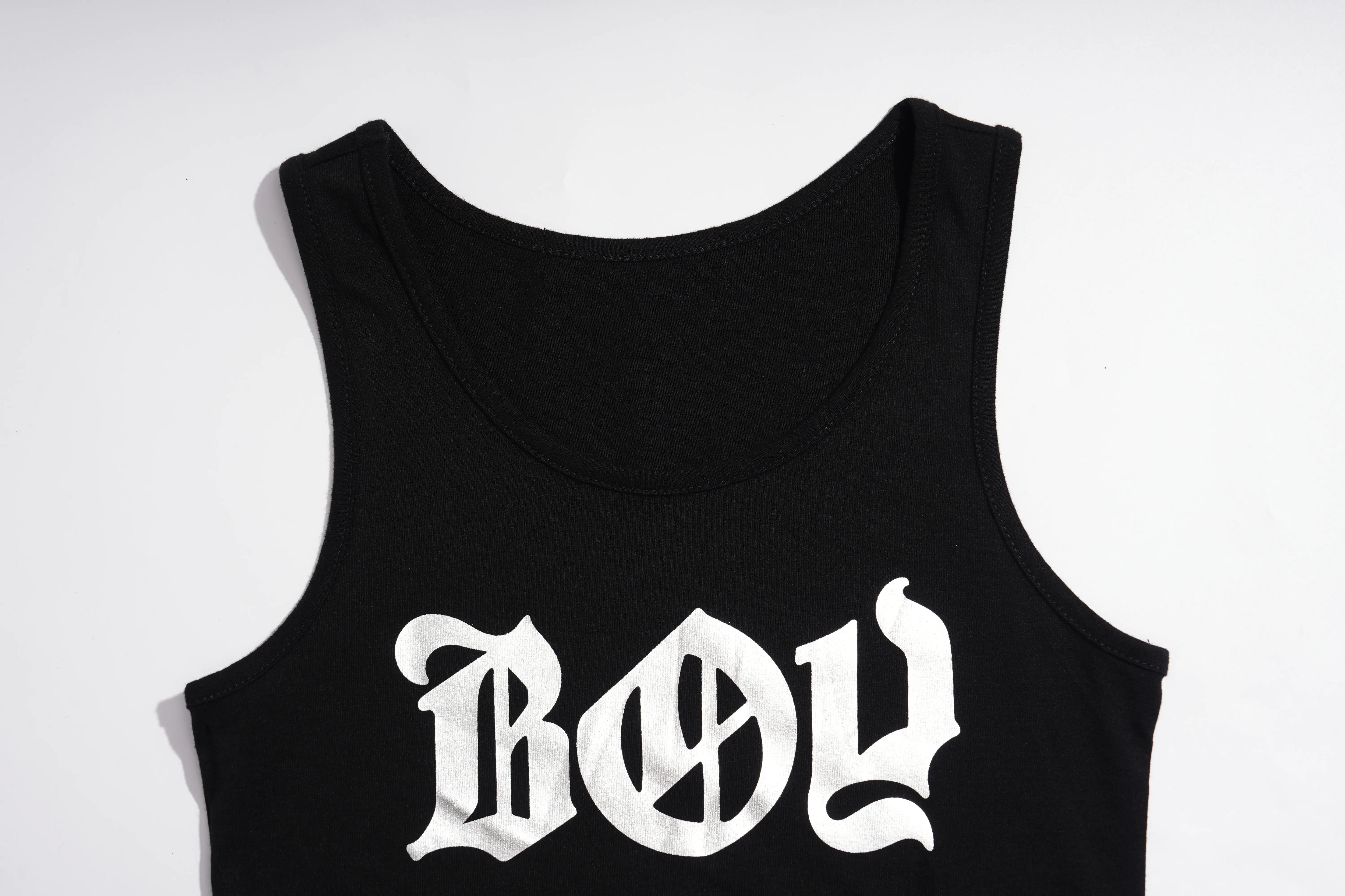 A black sleeveless tank top with a white Gothic-style 'BOY' graphic printed on the front, displayed against a plain white background. TCH Rhinestone Deer Graphic Mesh Sleeve Black Streetwear T-Shirt