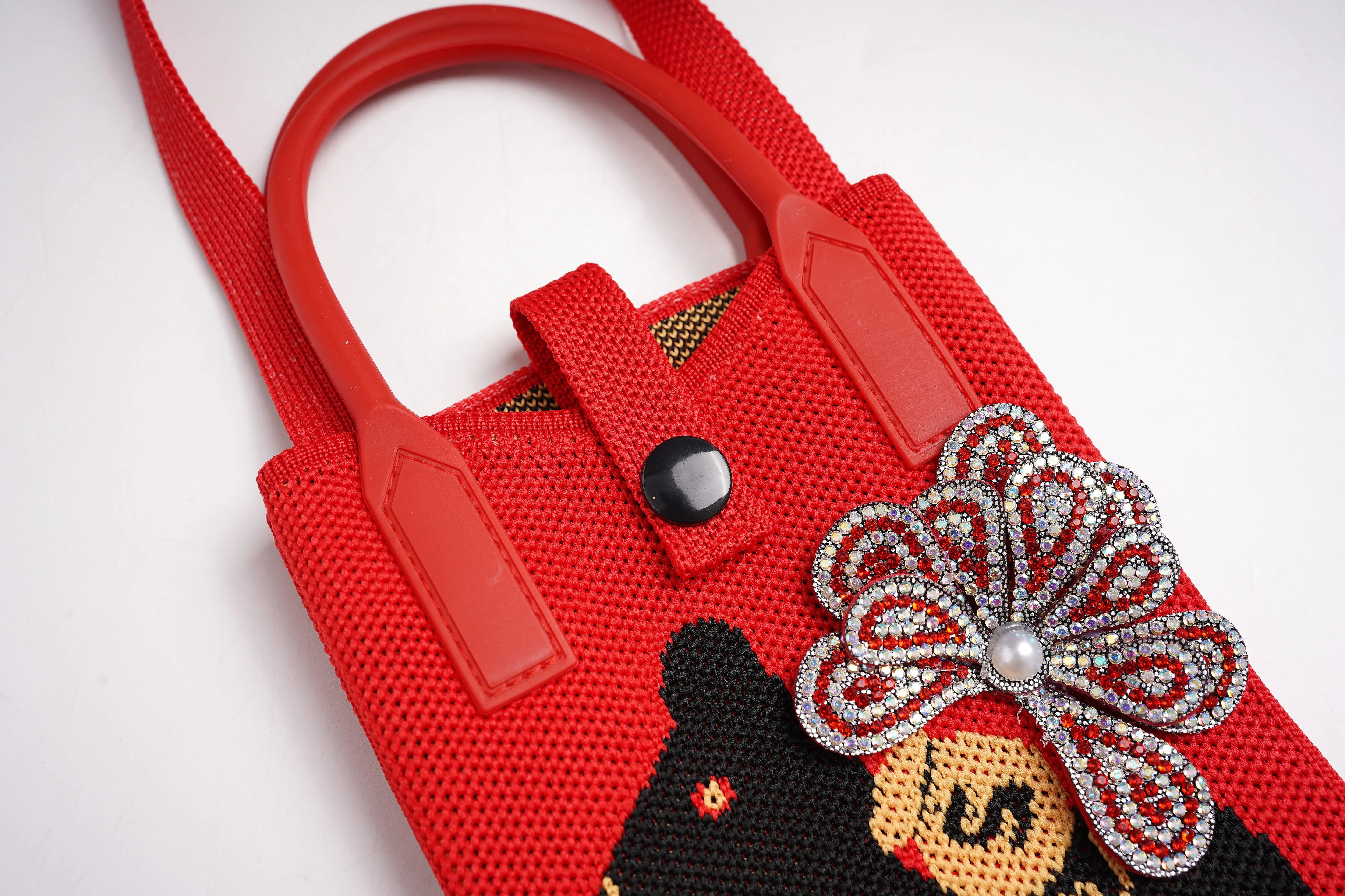 Red handbag with a decorative bow and character design on a white background, TCH Rhinestone Floral Black Horse Red Crossbody & Handbag