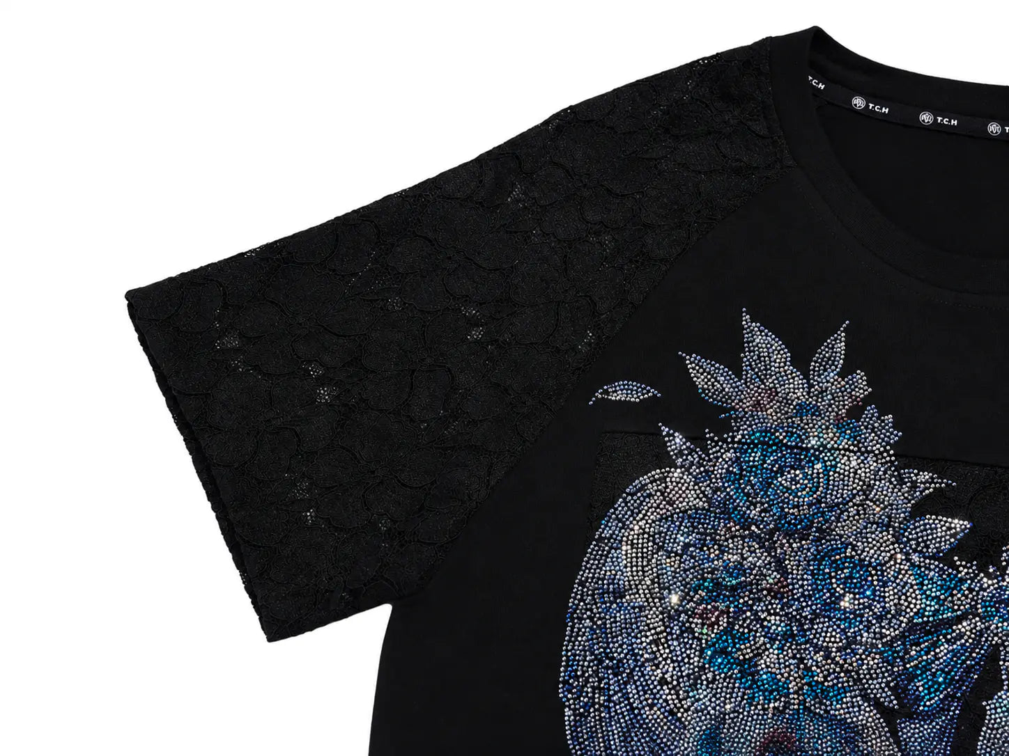 Close-up of a black short-sleeve T-shirt with a sheer lace sleeve and a large blue and silver rhinestone graphic on the front, shown on a white background. TCH Rhinestone Floral Wing Techno Graphic T-Shirt