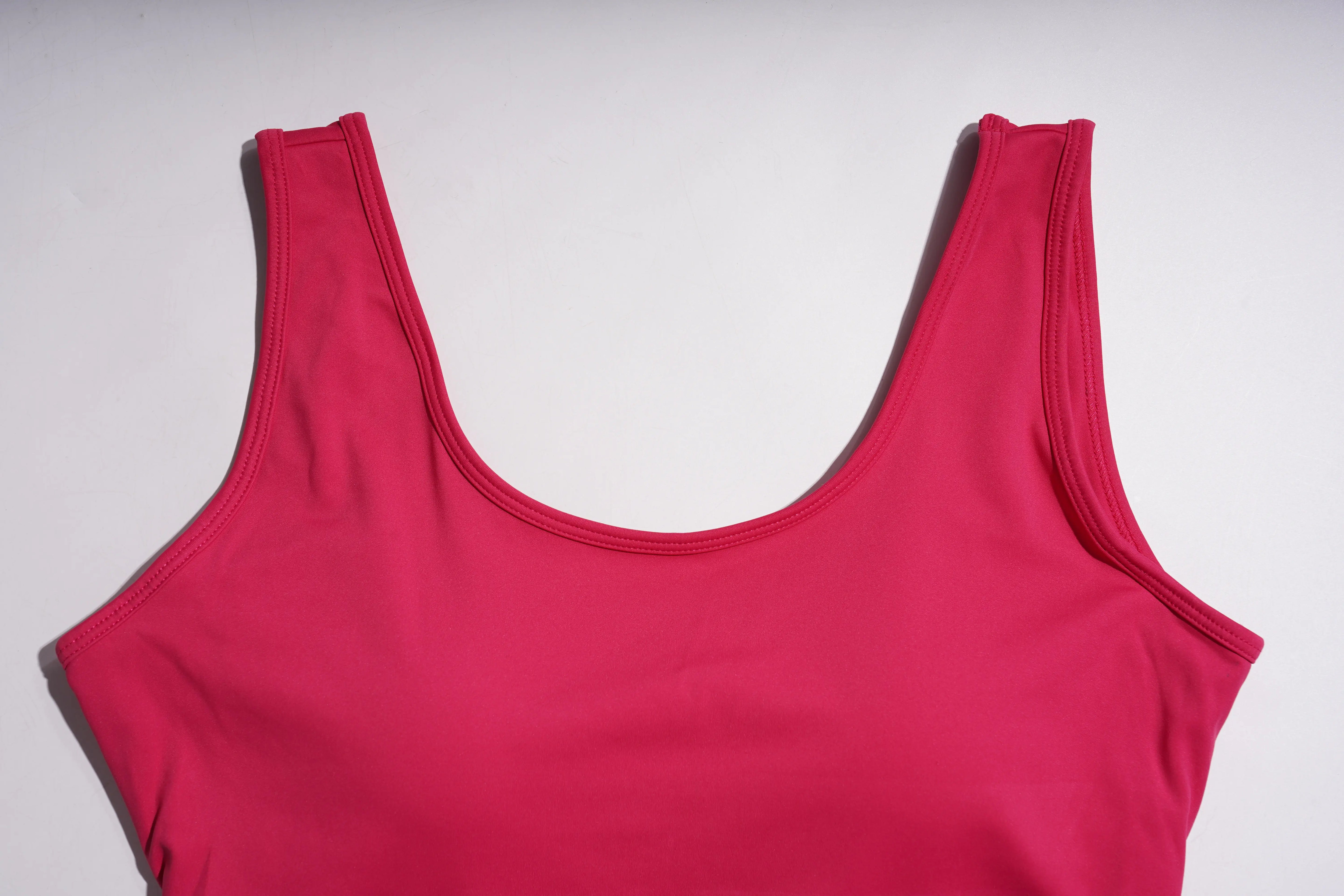 Pink tank top on a light gray background, TCH Rhinestone Floral Wing Yoga Jumpsuit-