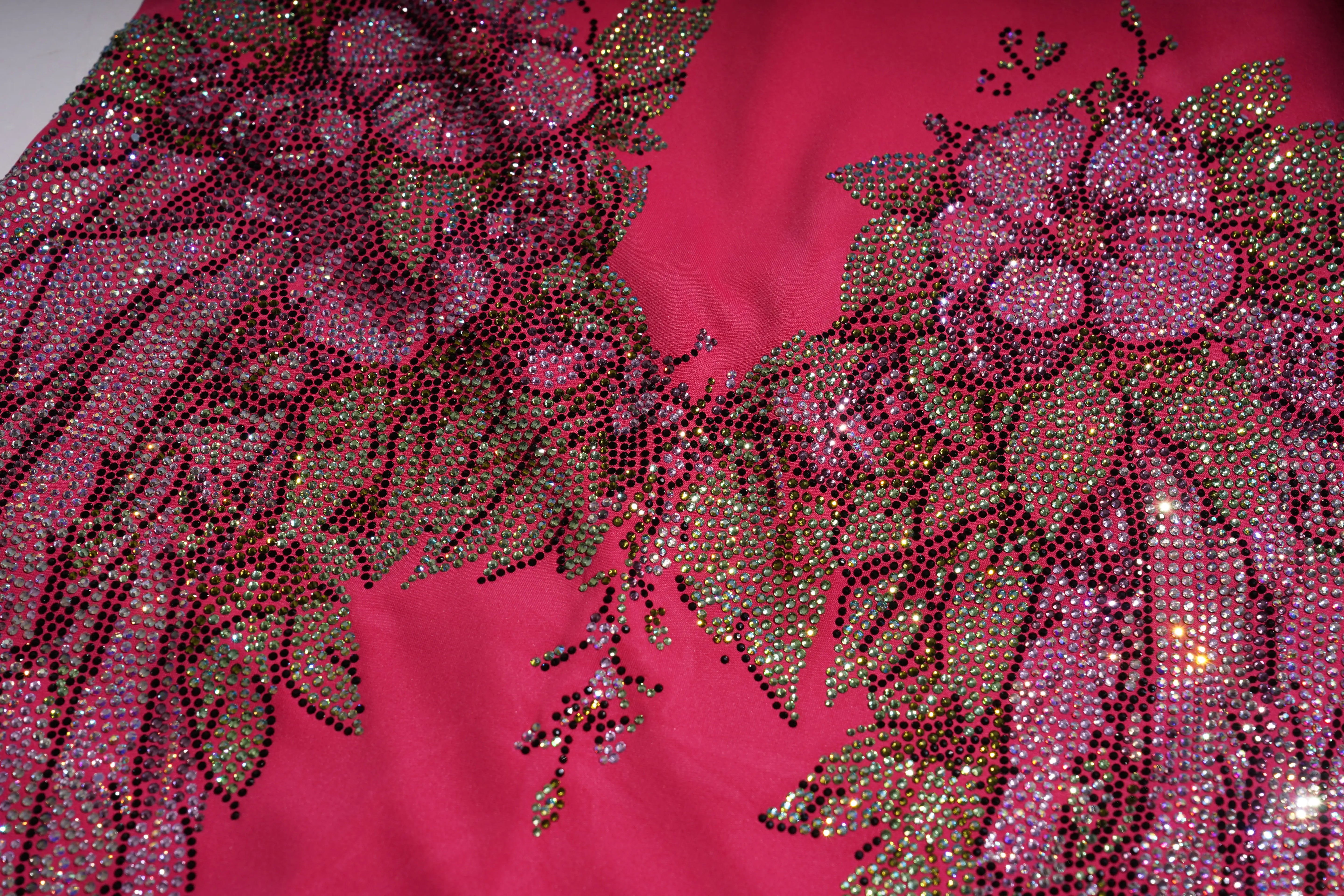 Decorative fabric with floral patterns and sequins on a pink background, TCH Rhinestone Floral Wing Yoga Jumpsuit-