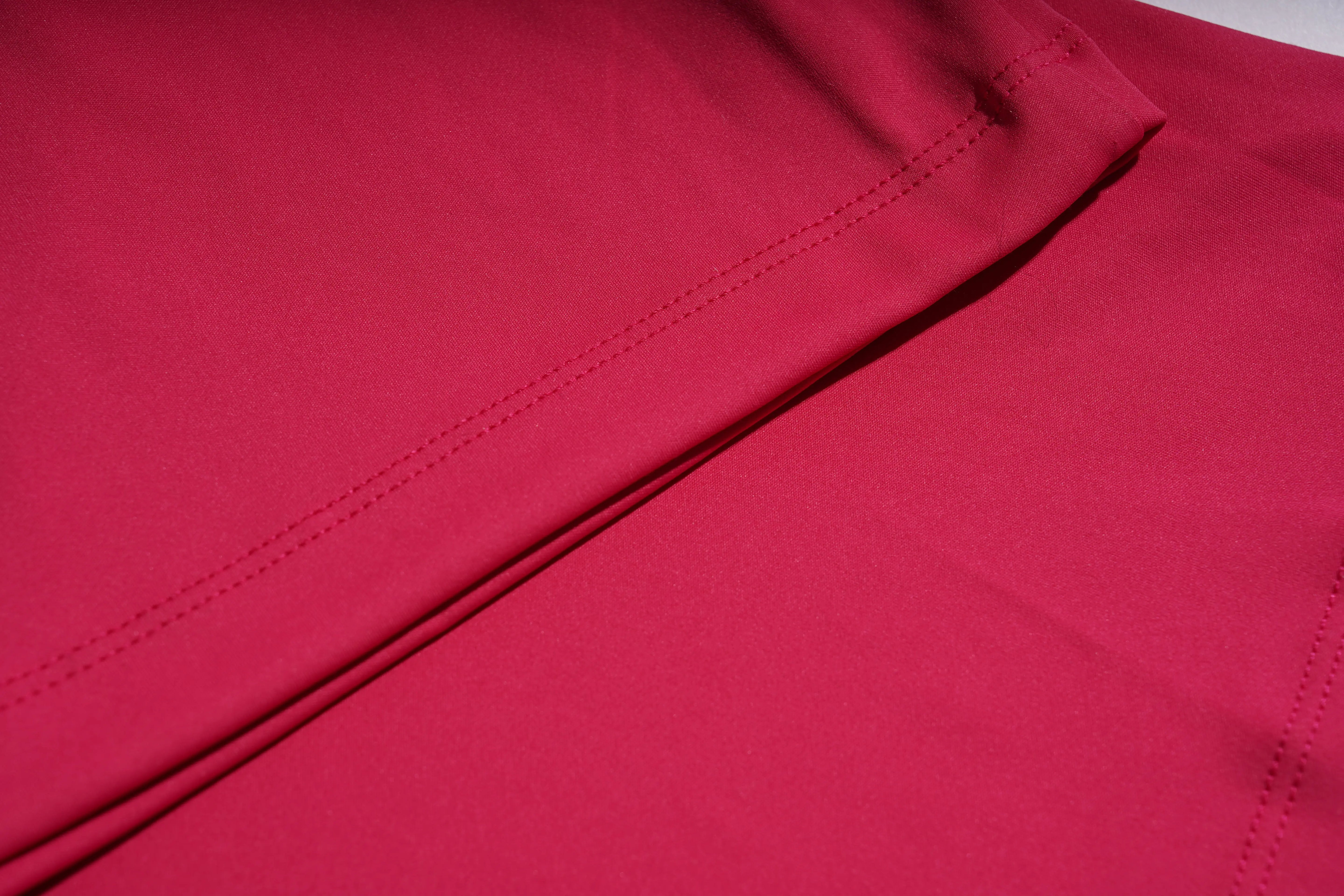 Close-up of red fabric with a visible seam
