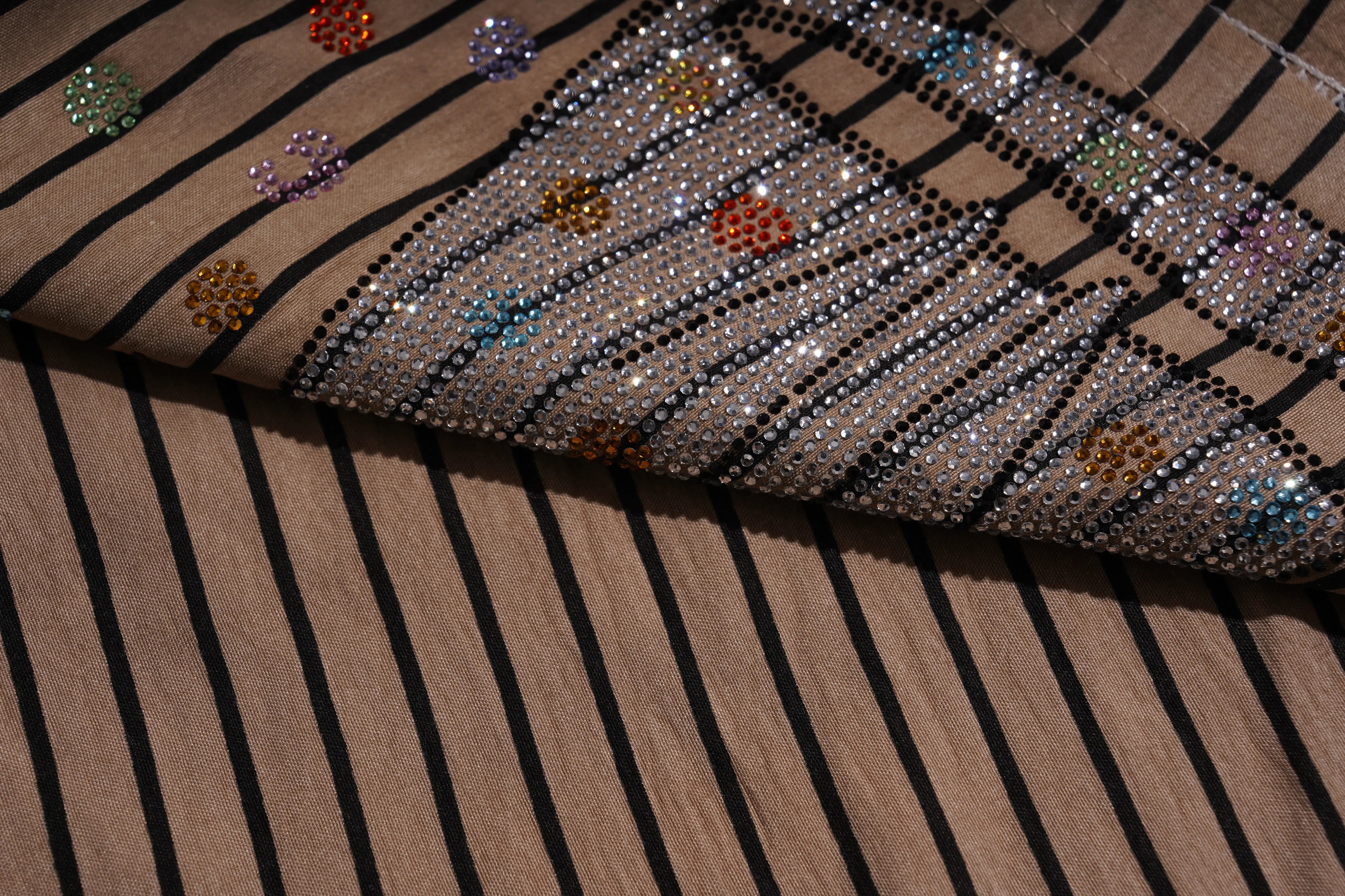 Close-up of a fabric with colorful embellishments on a brown striped background, TCH Rhinestone Graffiti Cat & Cherry Set