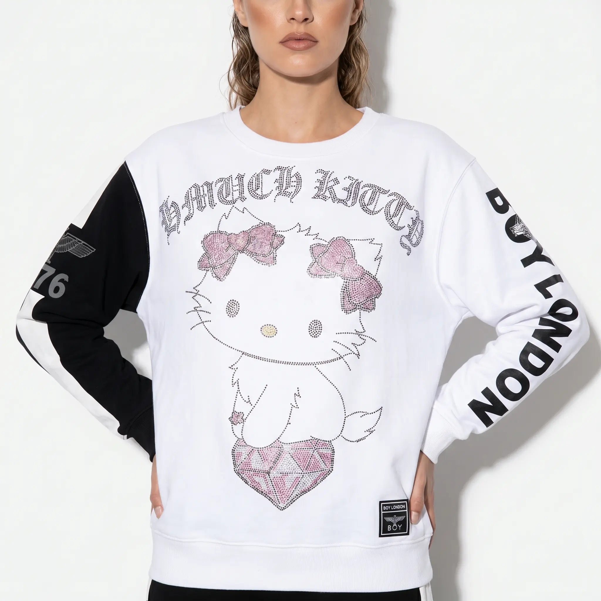 White sweatshirt with Hello Kitty design and text on sleeves against a white background, TCH Rhinestone Hello Kitty BOYLONDON Sweatshirt