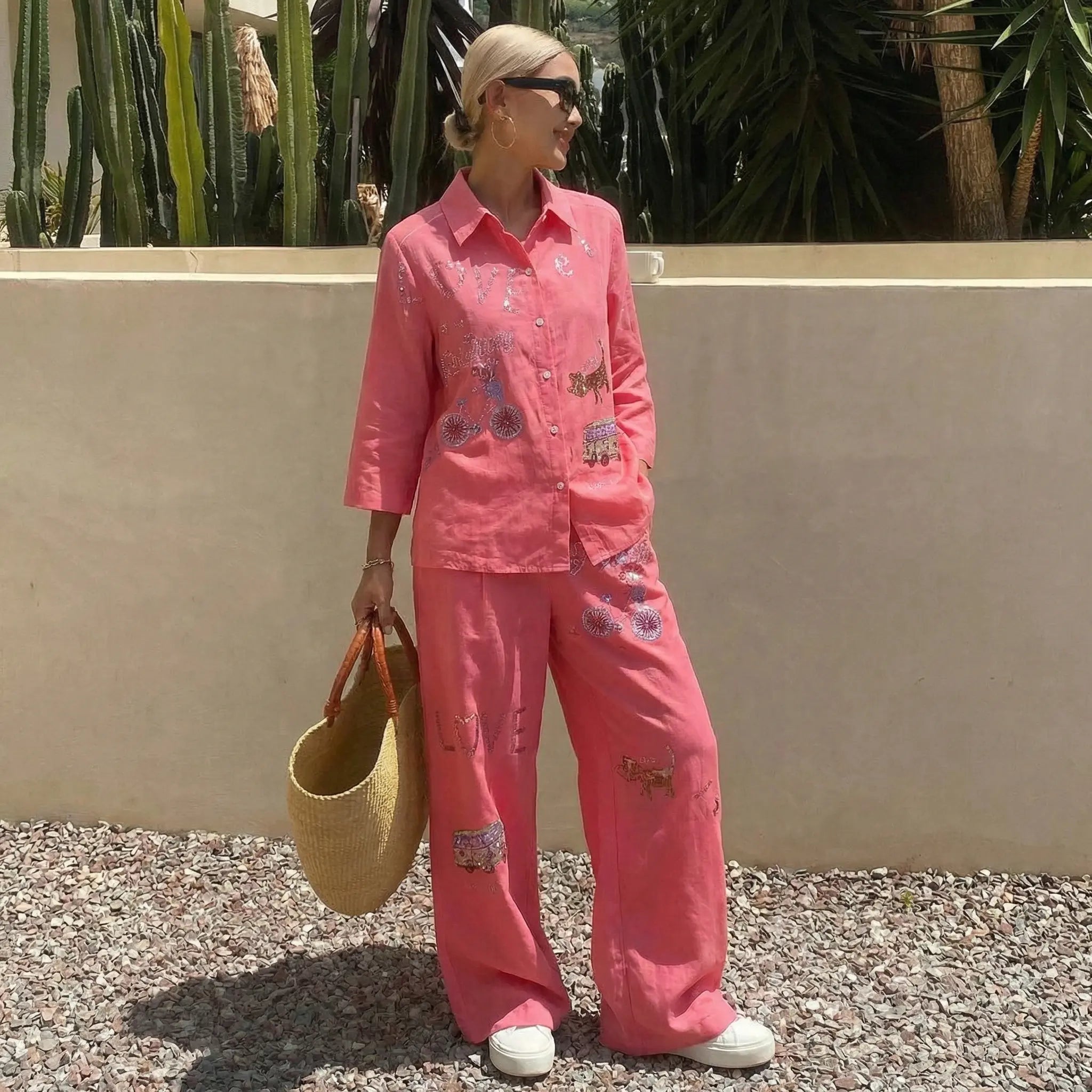 Woman in a pink outfit with animal prints standing outdoors against a beige wall., TCH Rhinestone Love Lucky Pig Set