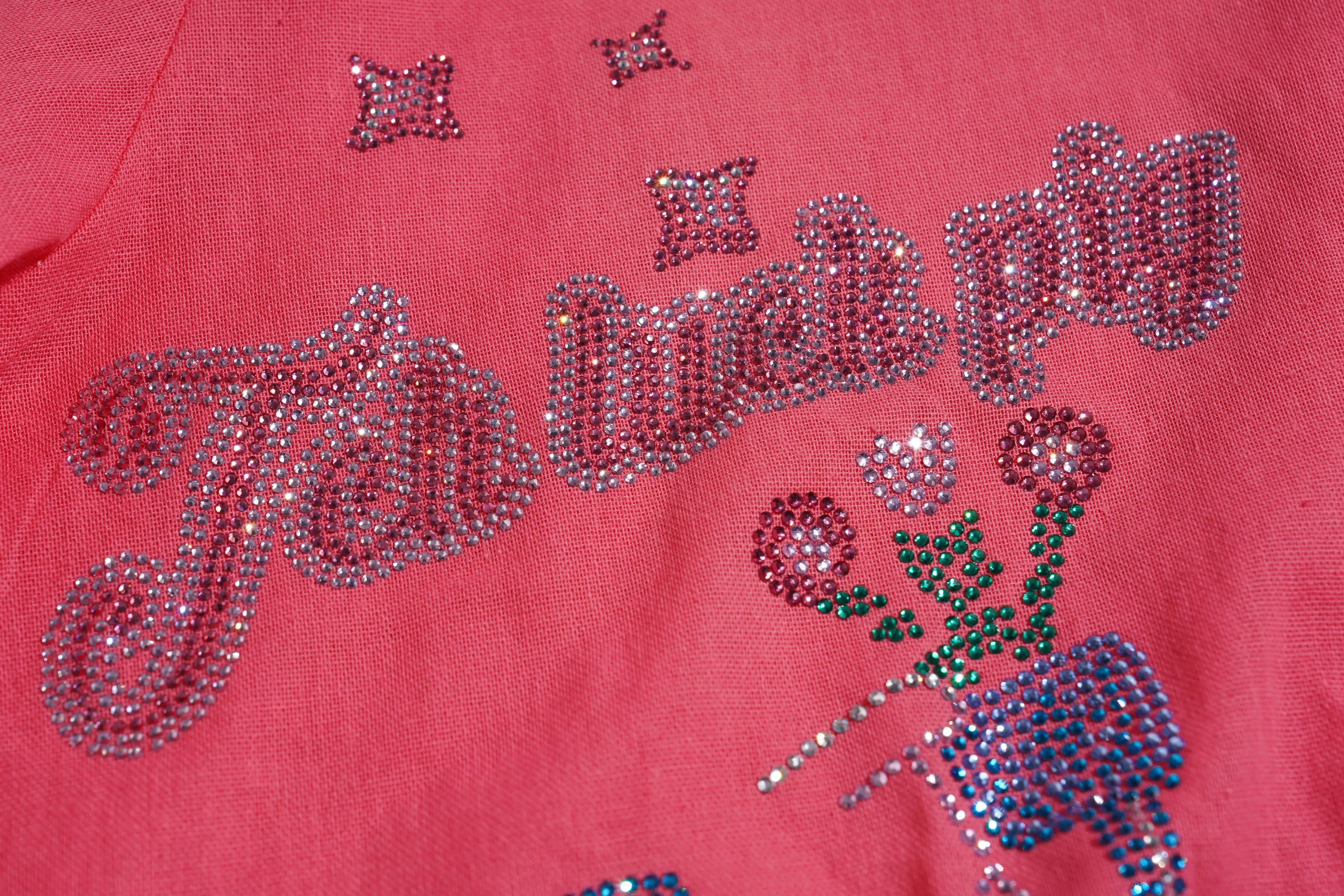 Decorative pink fabric with rhinestone embellishments on a red background, TCH Rhinestone Love Lucky Pig Set