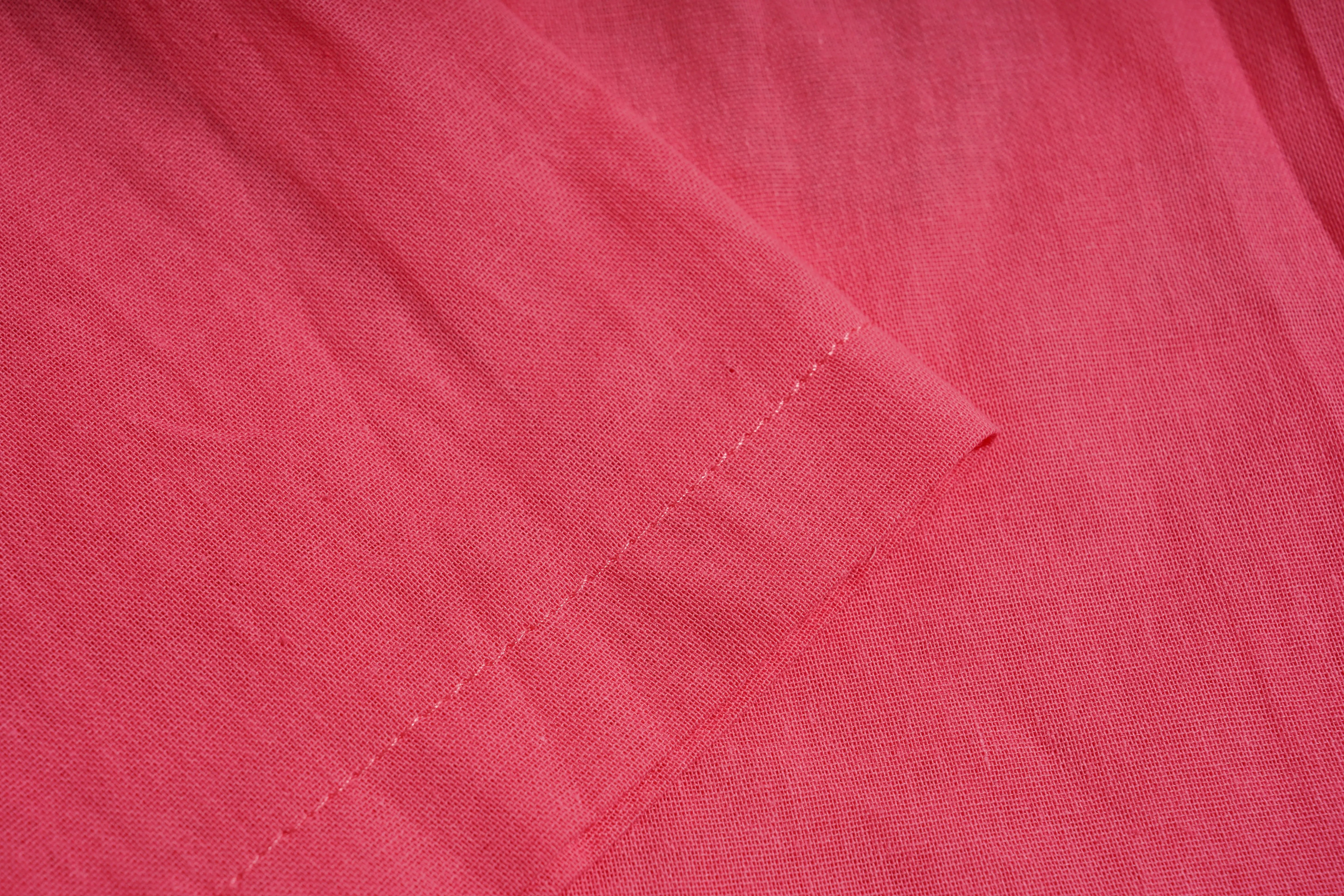 Close-up of pink fabric with a visible seam, TCH Rhinestone Love Lucky Pig Set