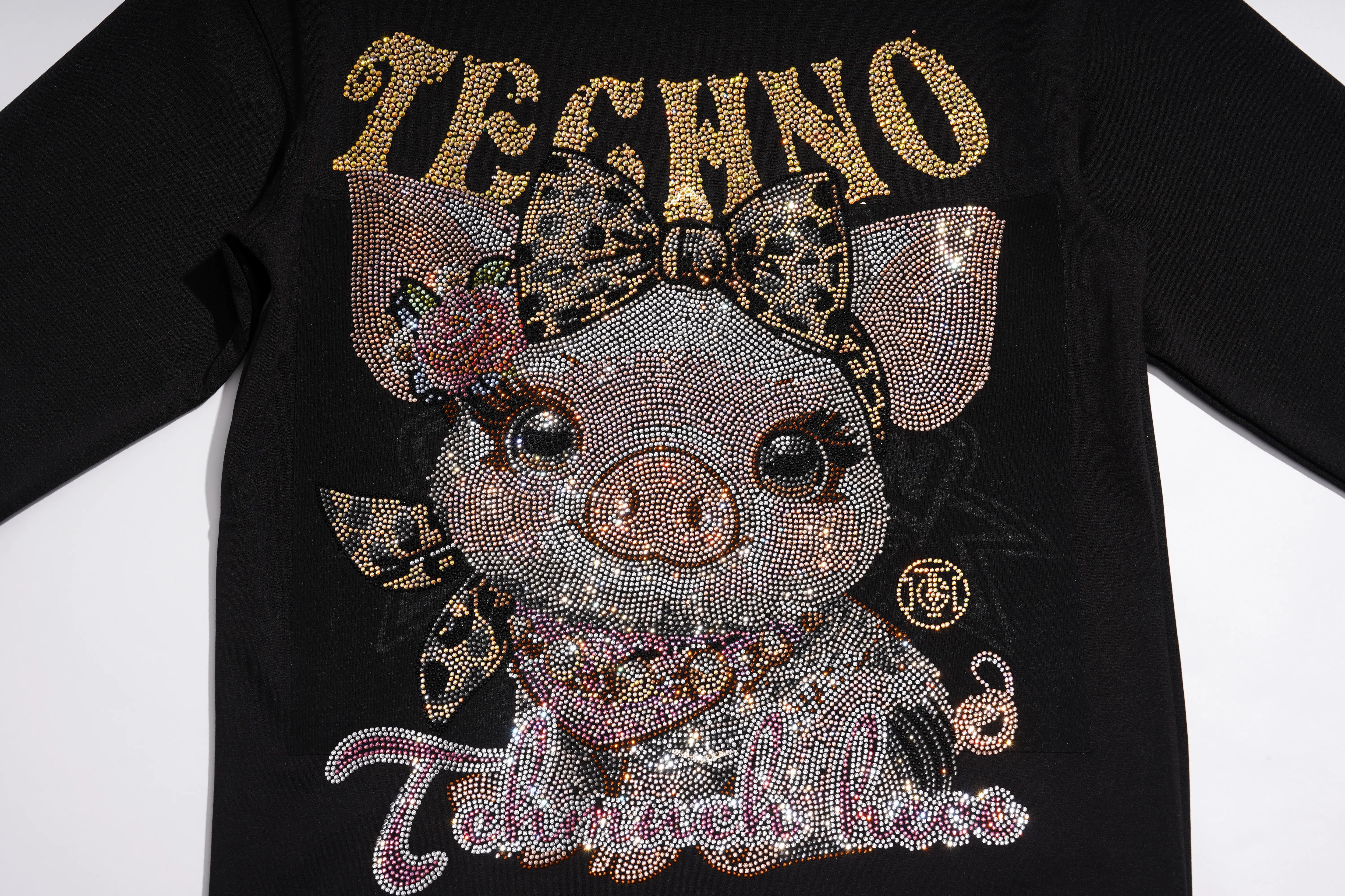 A black long-sleeve T-shirt featuring a large rhinestone-embellished graphic of a pig wearing a leopard-print bow, with the word 'TECHNO' in gold rhinestones across the chest. TCH Rhinestone Pig Graphic Long Sweatshirt Dress