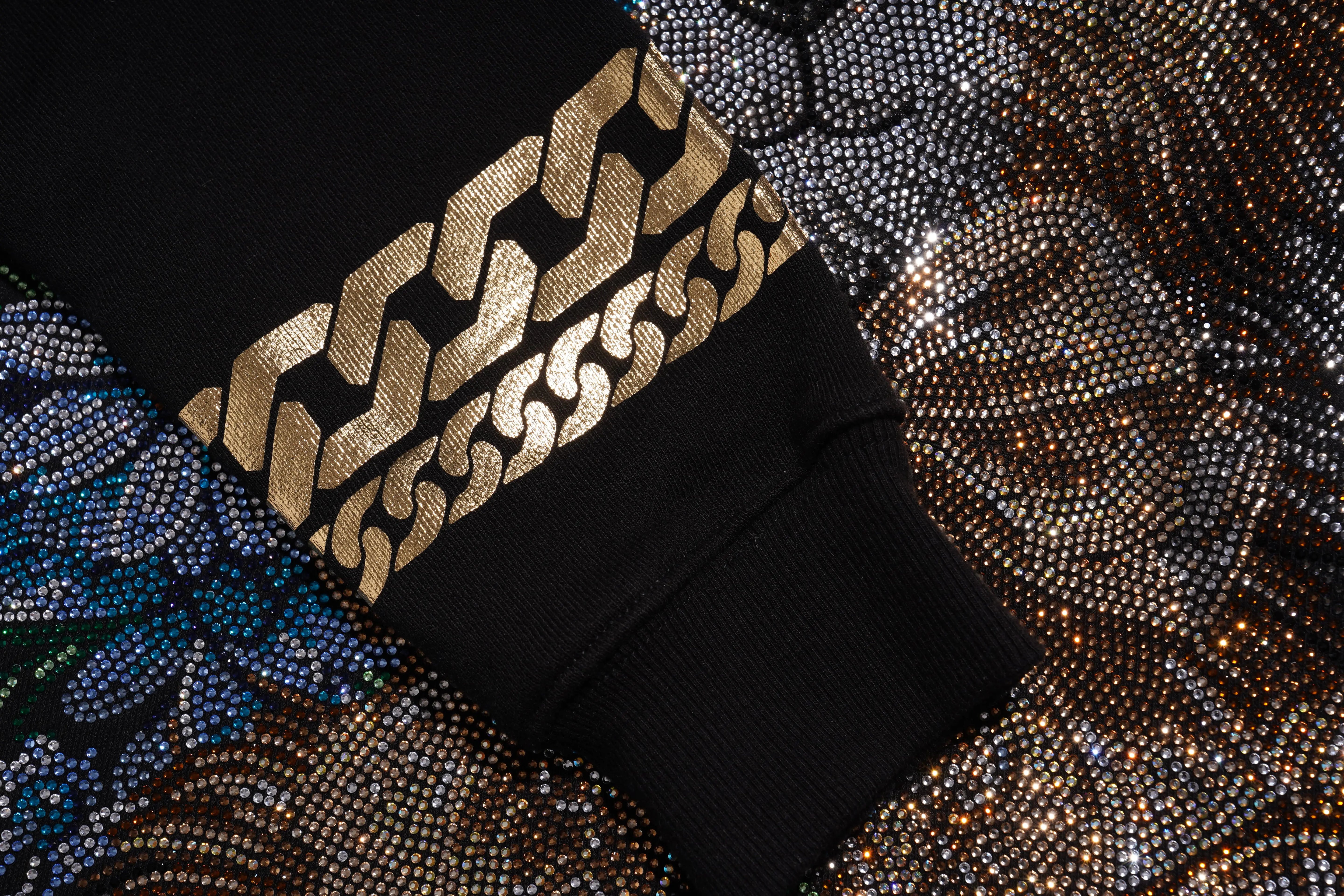 Black fabric with gold geometric pattern on a textured background, TCH Rhinestone Puppy Black Streetwear Sweatshirt