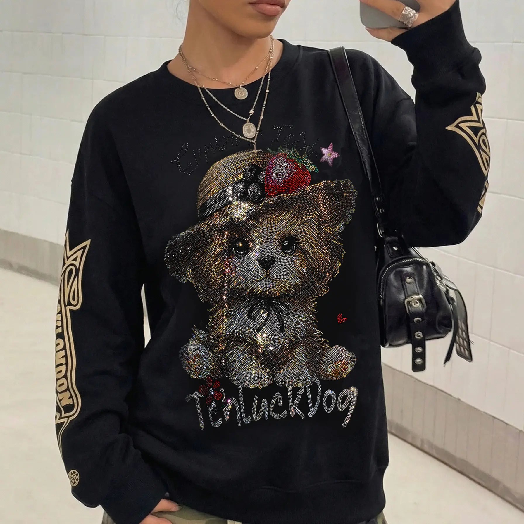 Person wearing a black sweatshirt with a teddy bear graphic and 'TenluckDog' TCH Rhinestone Puppy Graphic Sweatshirt-text.