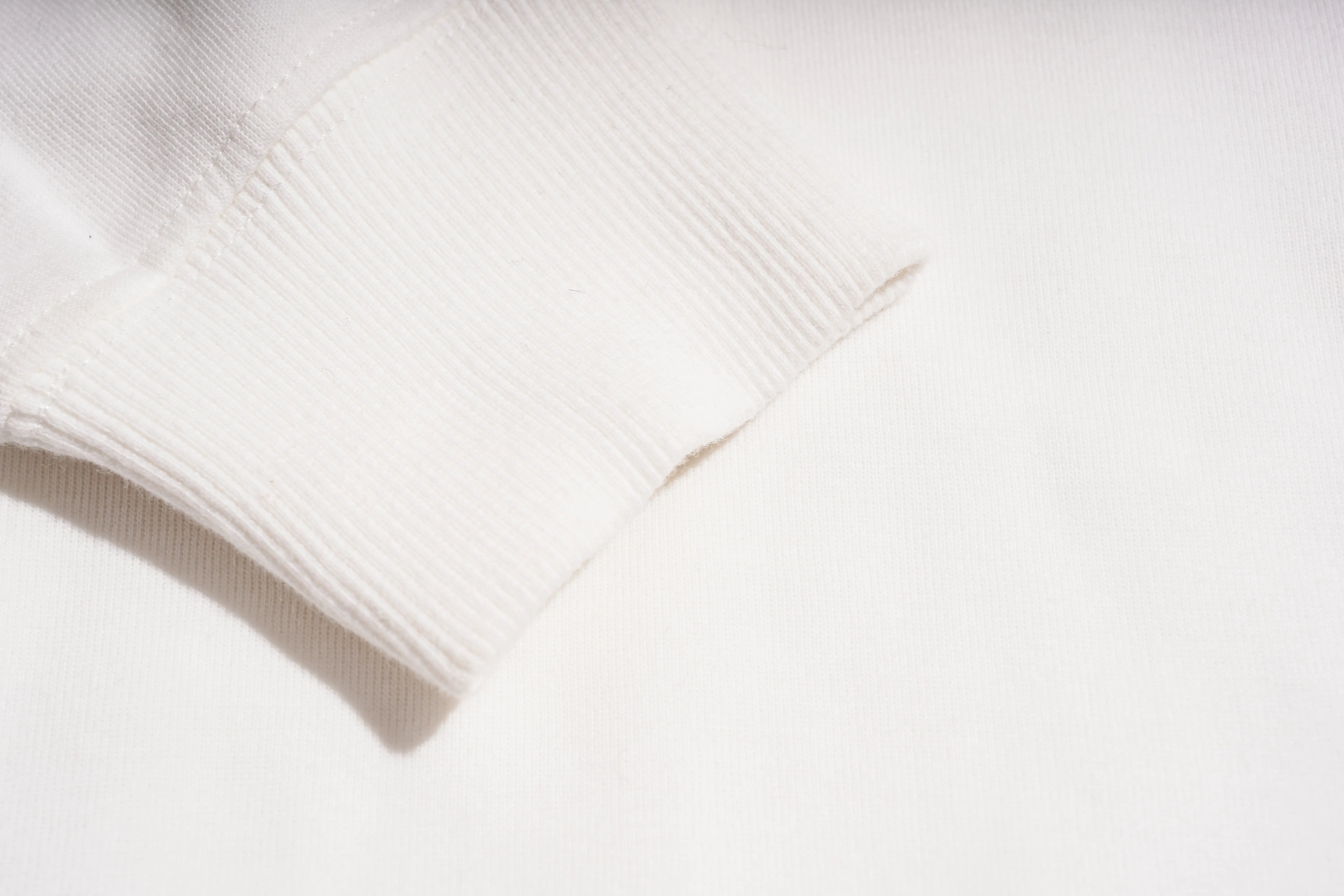 Close-up of a white fabric texture with a subtle pattern