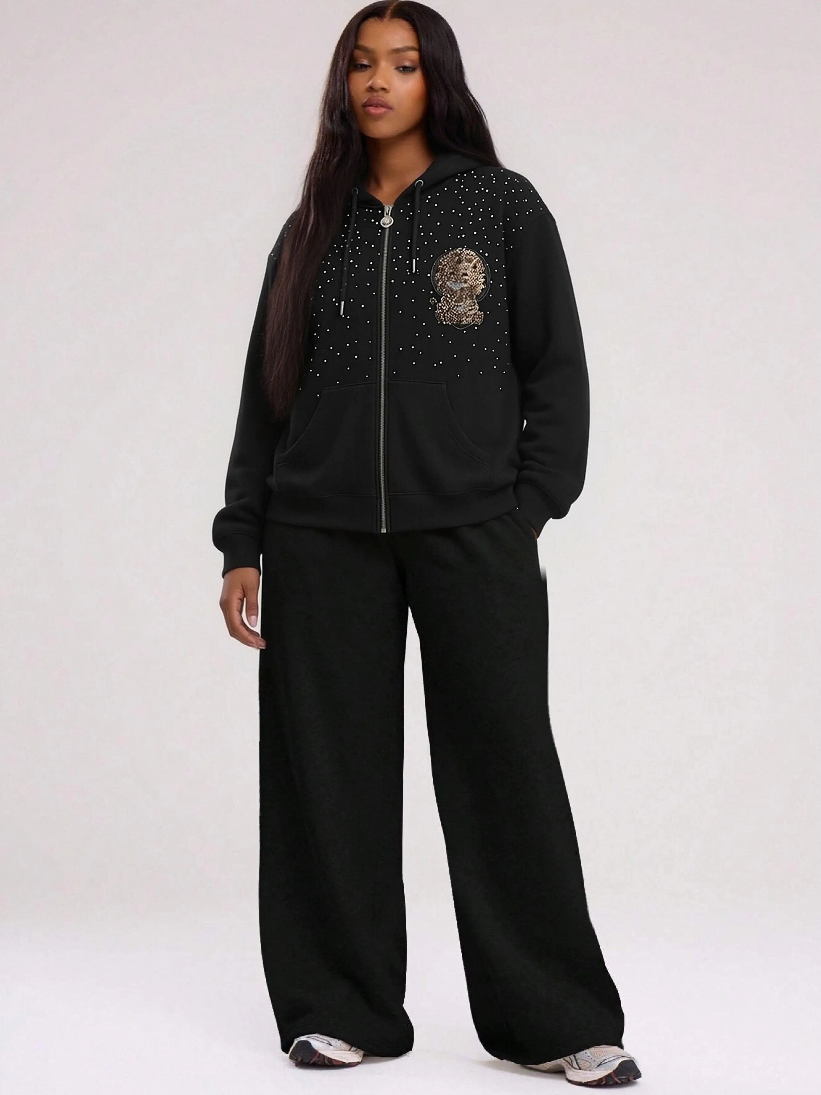Person wearing a black tracksuit with decorative elements on a white background, TCH Rhinestone Starry Sky Lion Hoodie