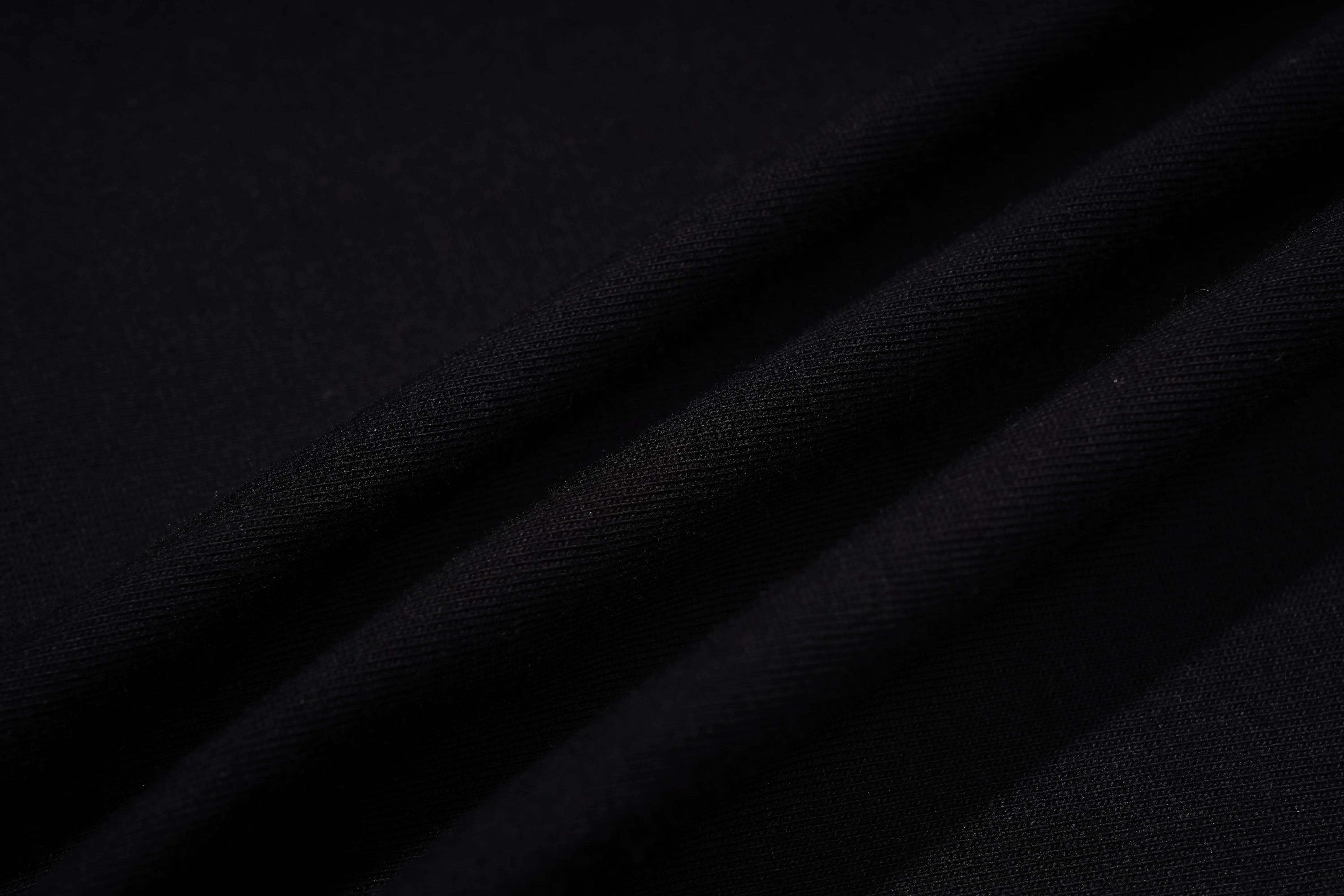 Close-up of black fabric texture, TCH Rhinestone Teddy Bear Black T-Shirt