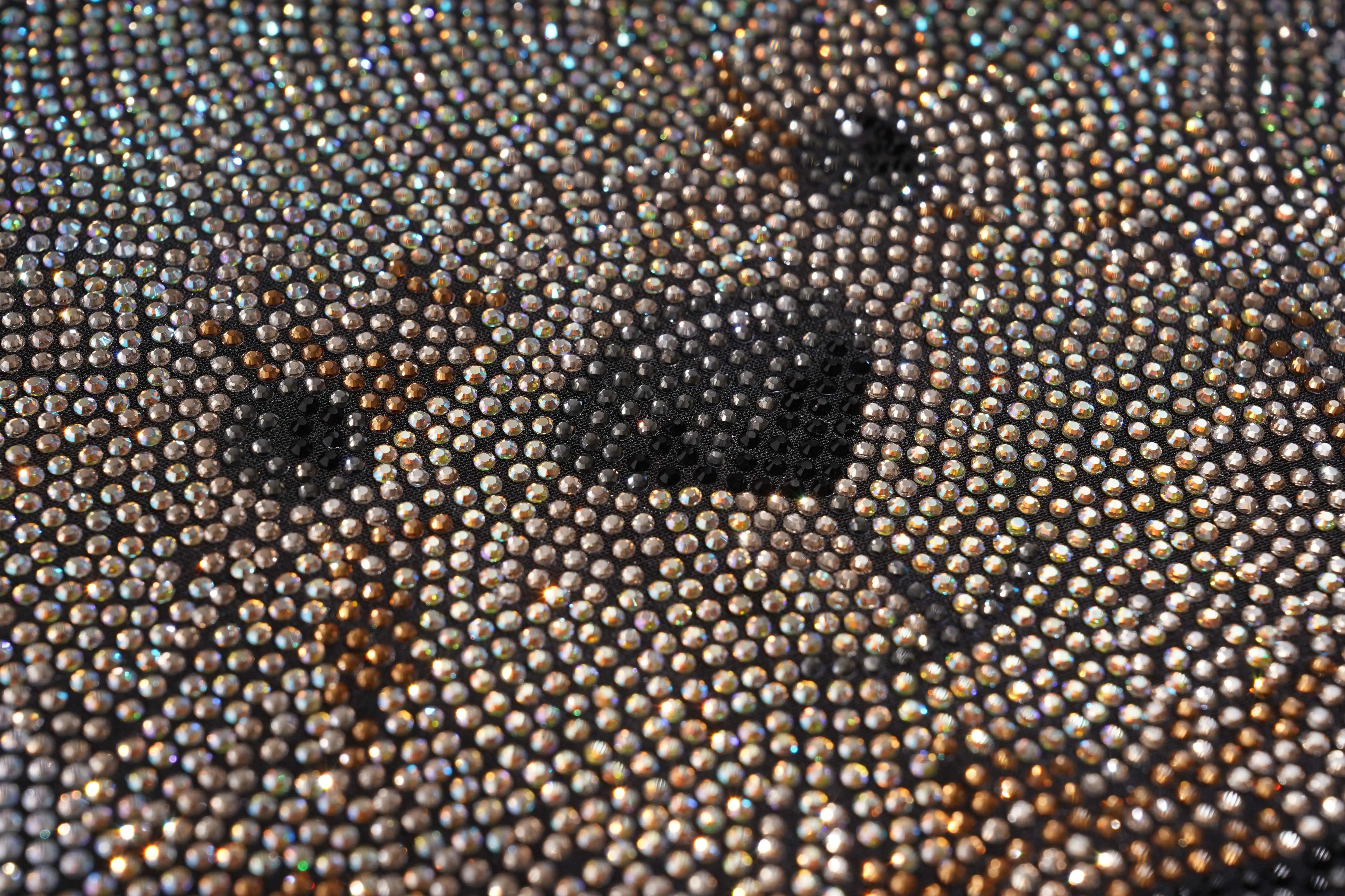 Close-up of a textured surface with small beads or stones. TCH Rhinestone Teddy Bear Black T-Shirt