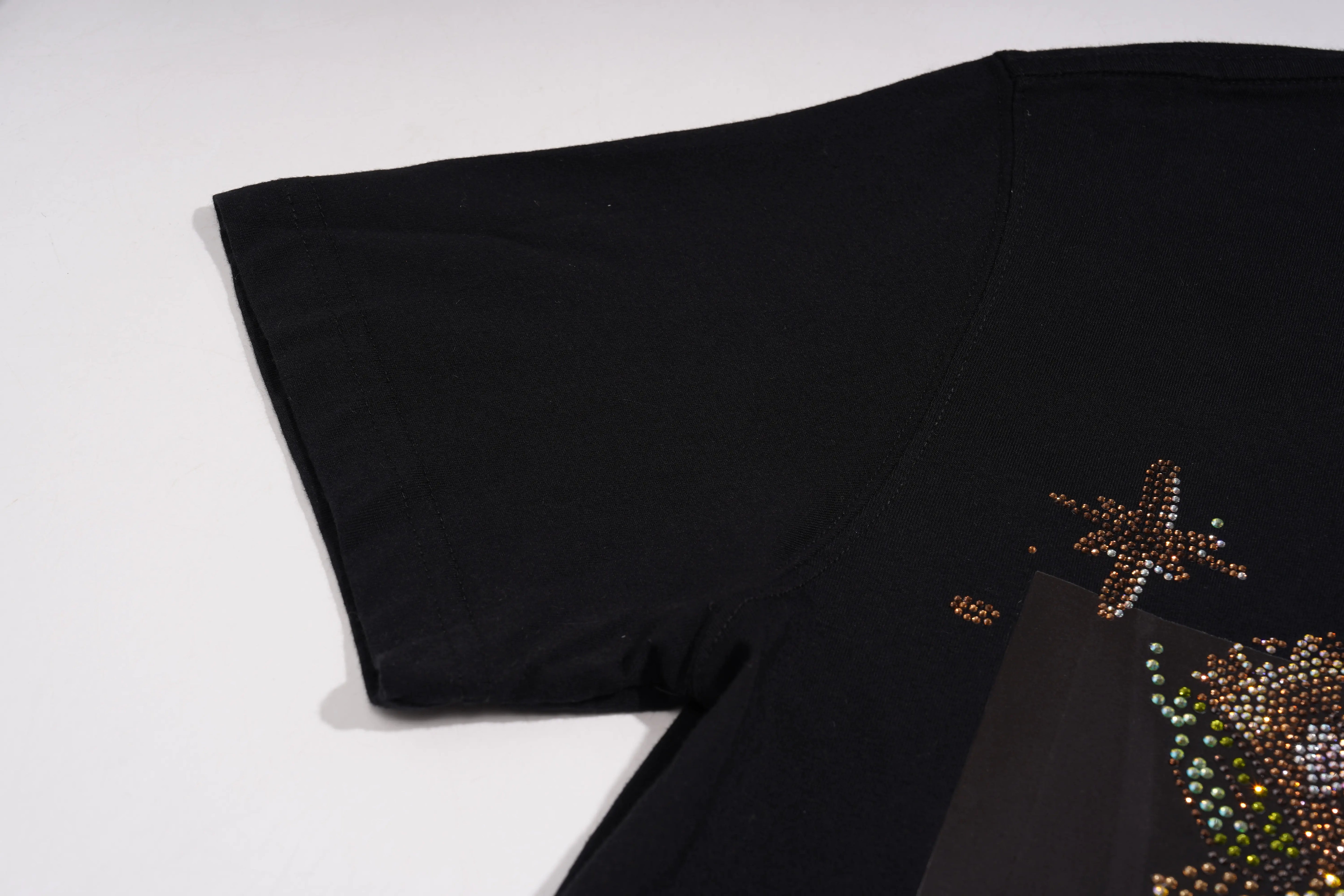Black fabric with star-shaped embellishments on a white background, TCH Rhinestone Teddy Bear Bouquet Black T-Shirt
