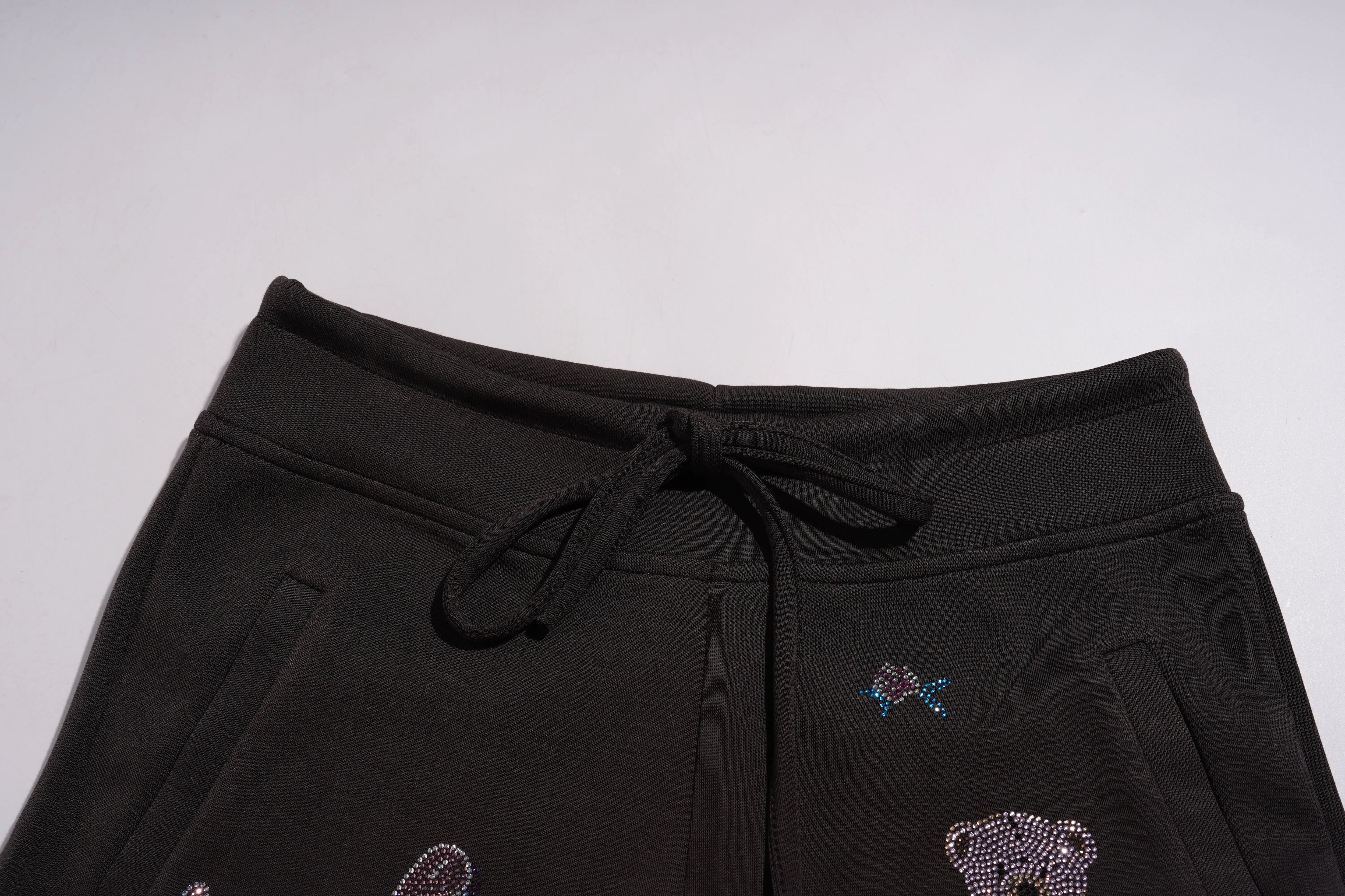 Black pants with rhinestone bear designs on a light gray background, TCH Rhinestone Teddy Bear & Bow Set