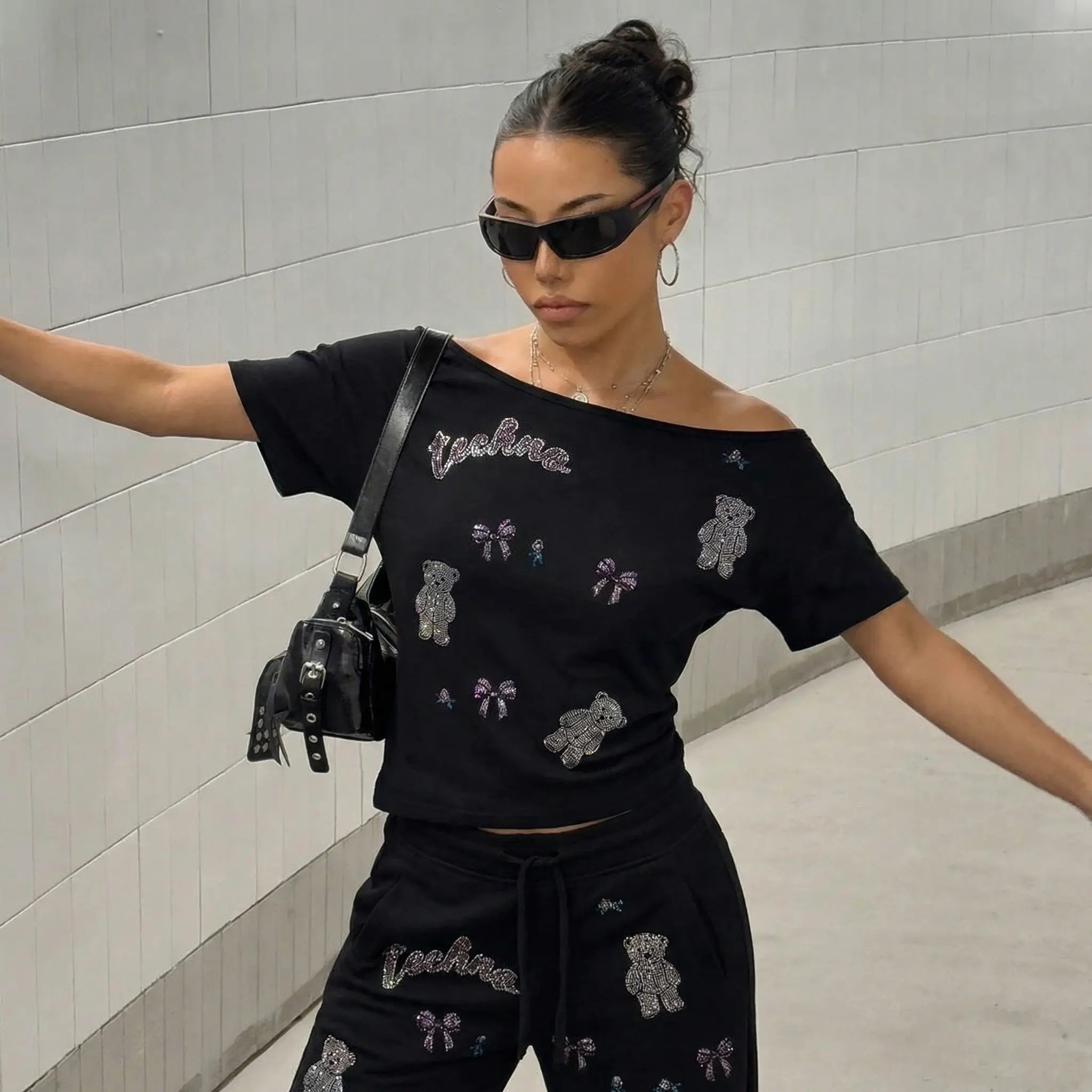 Woman wearing a black outfit with embroidered designs in an indoor setting, TCH Rhinestone Teddy Bear & Bow Set