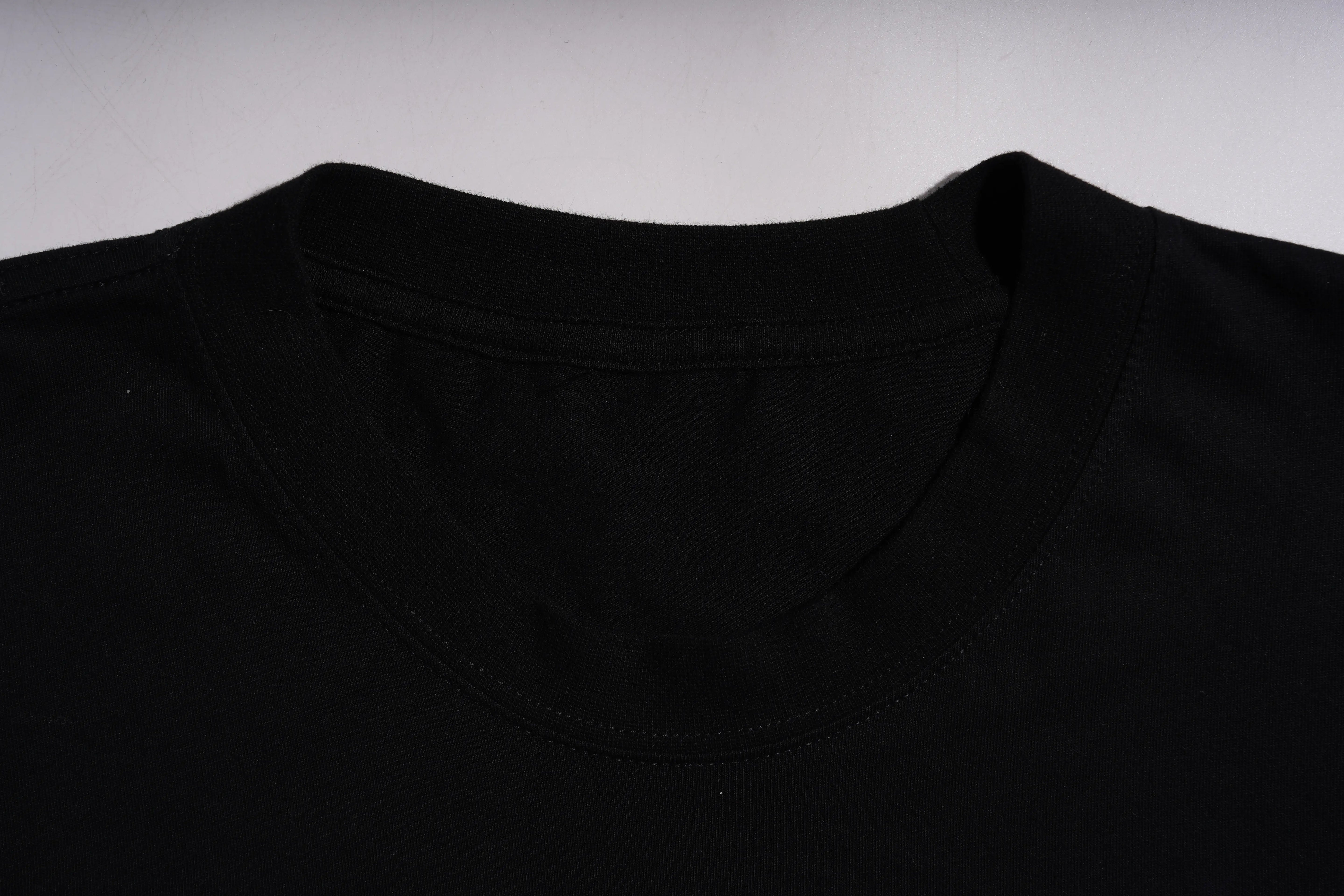Close-up of a black shirt with a plain background TCH Rhinestone Teddy Bear Graphic Crewneck Sweatshirt-7