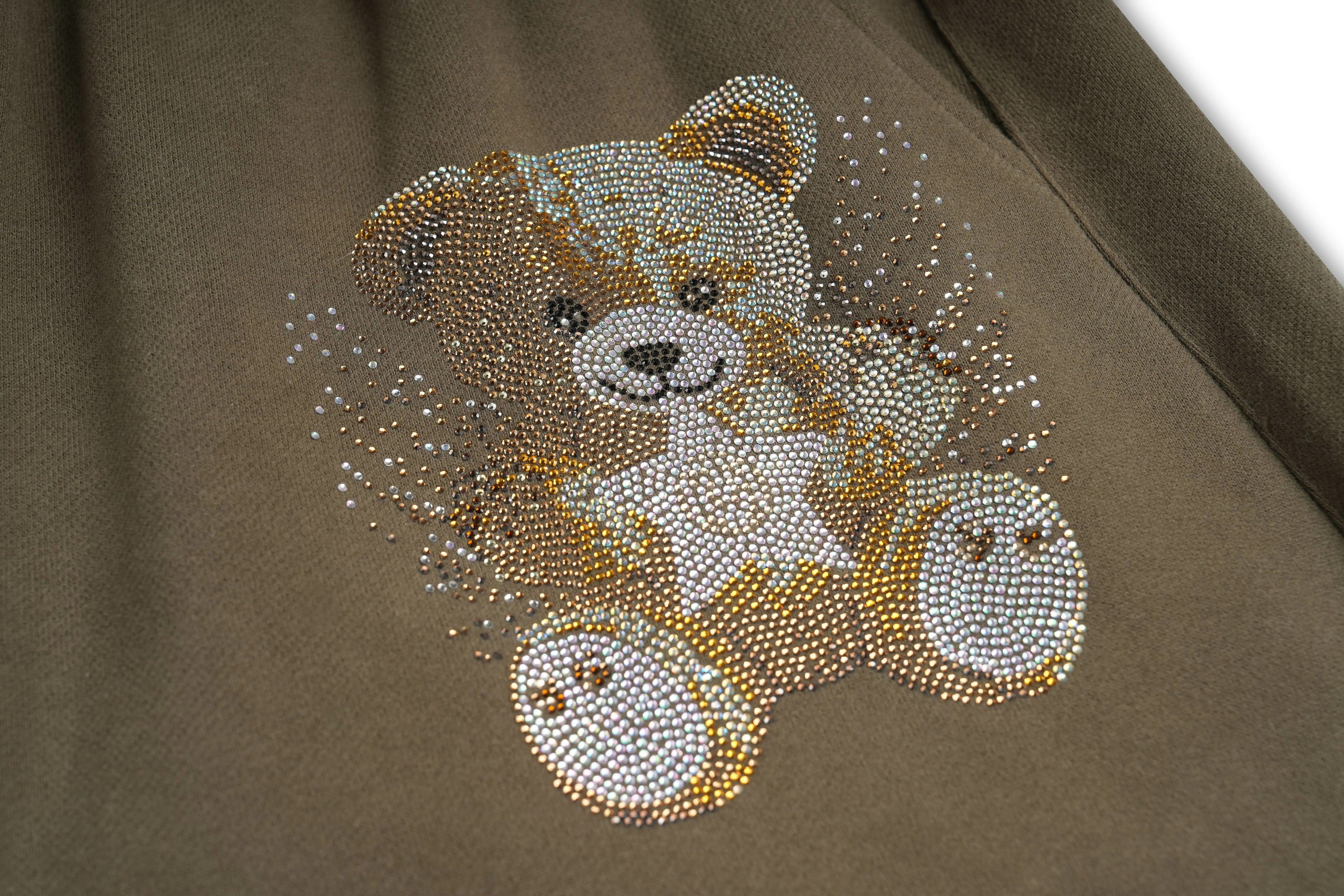 Brown teddy bear with rhinestone embellishments on a brown fabric background, TCH Rhinestone Teddy Bear Military Green Zip Turtleneck Set