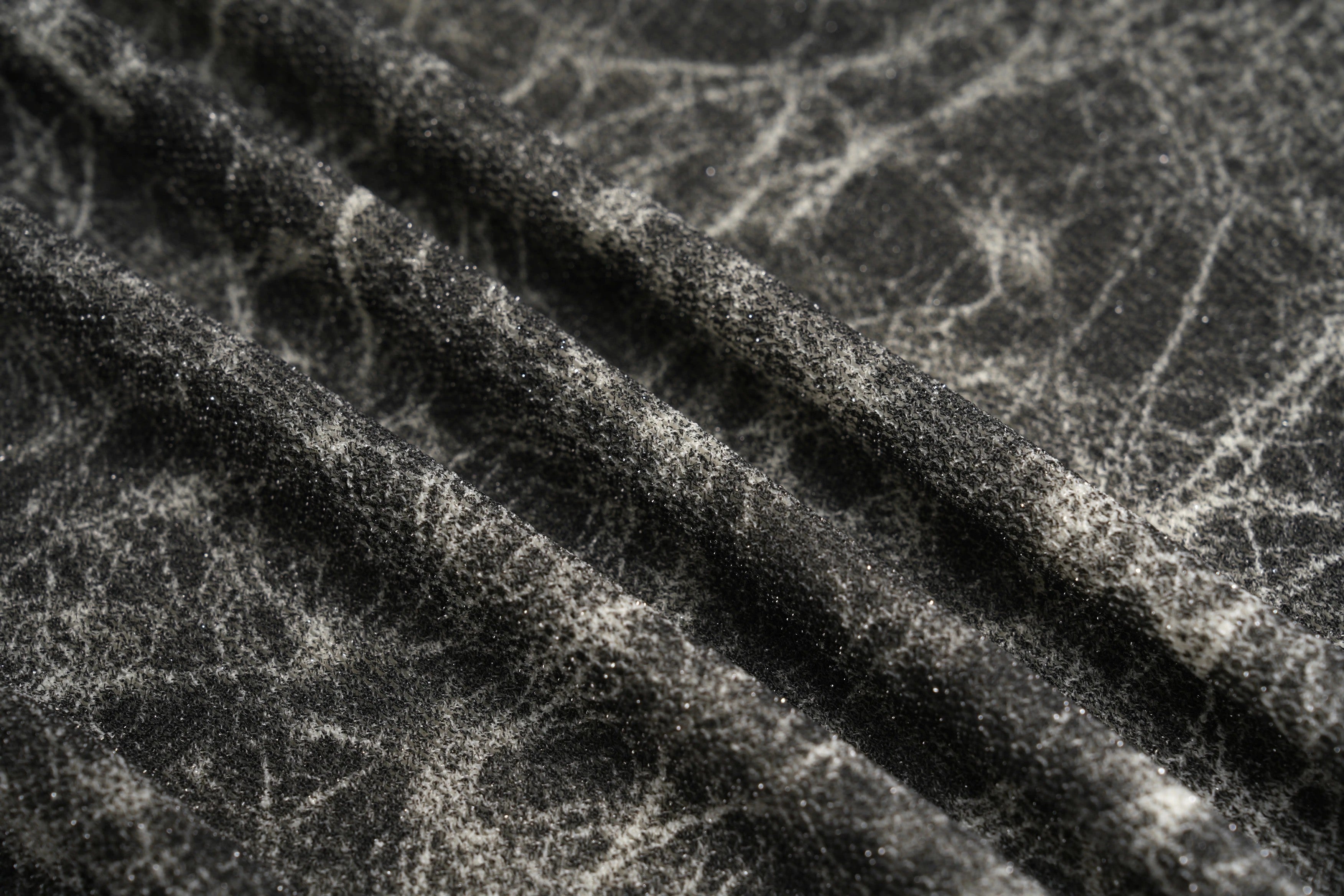 Close-up of a textured black and white fabric surface, TCH Rhinestone Web Mirror Slim-Fit Long Sleeve Tee