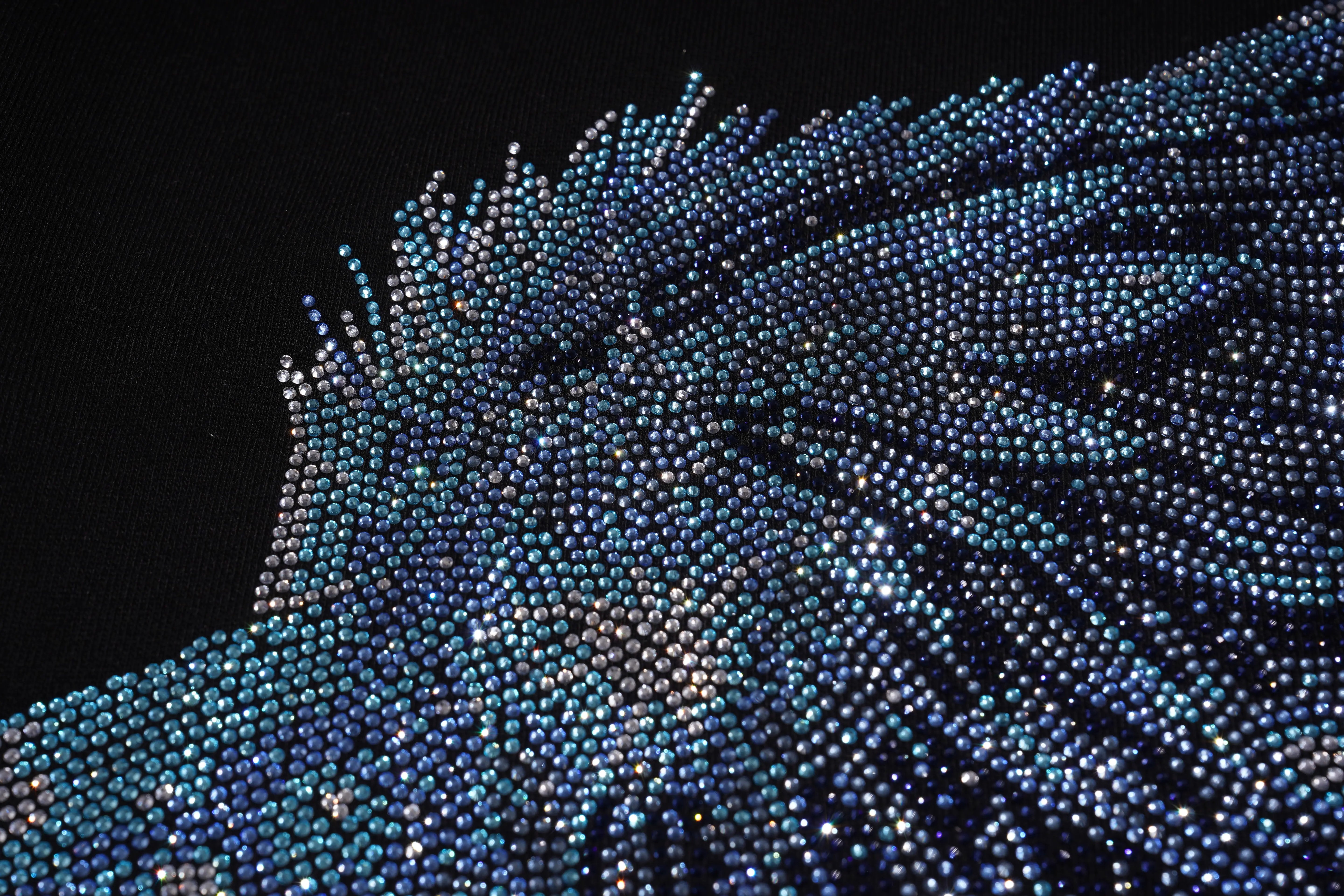 Close-up of a blue beaded flower against a black background, TCH Rhinestone Wing Black Crewneck Sweatshirt