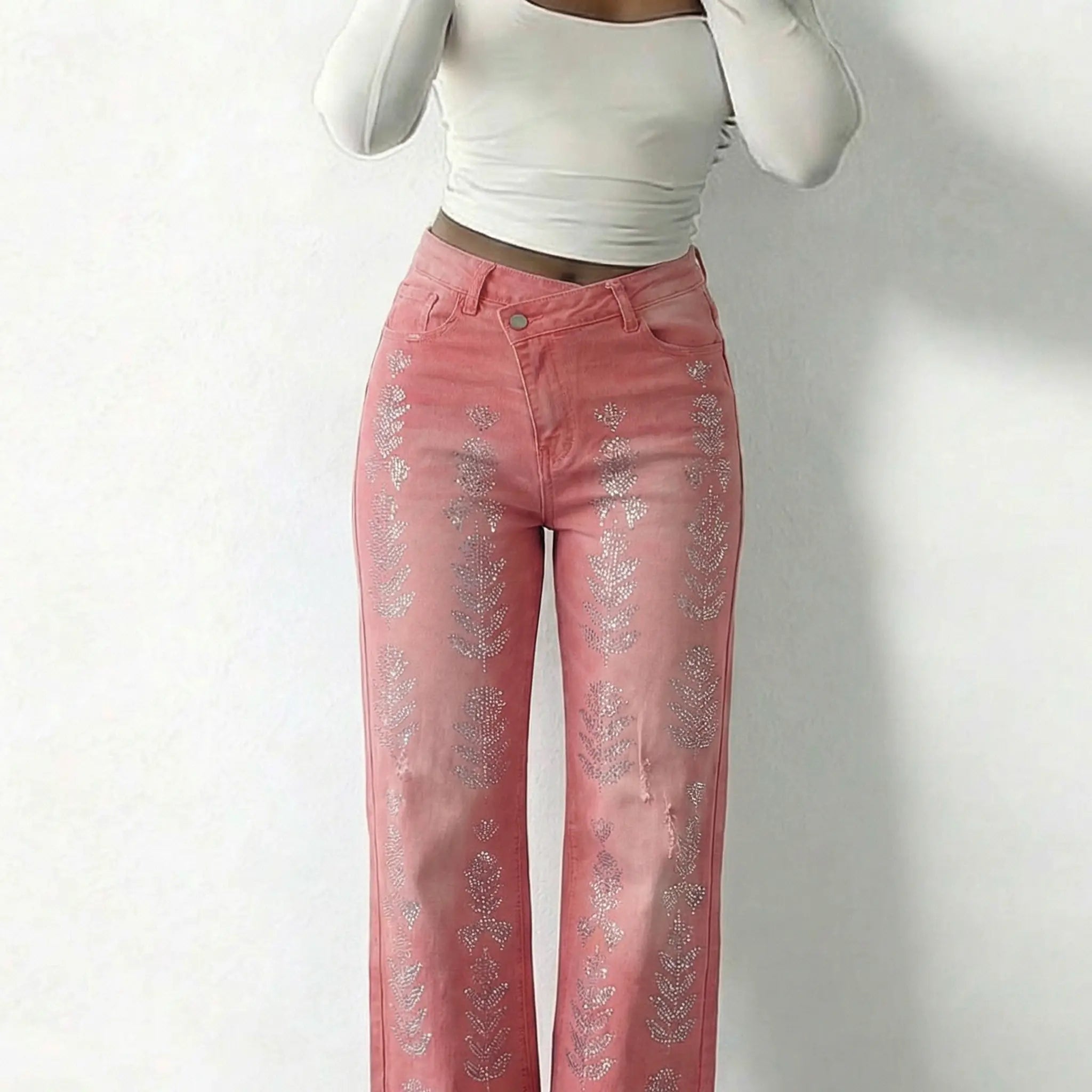Pink jeans with floral patterns worn by a person on a white background, TCH Silver Bouquet Rhinestone Pink Denim Jeans