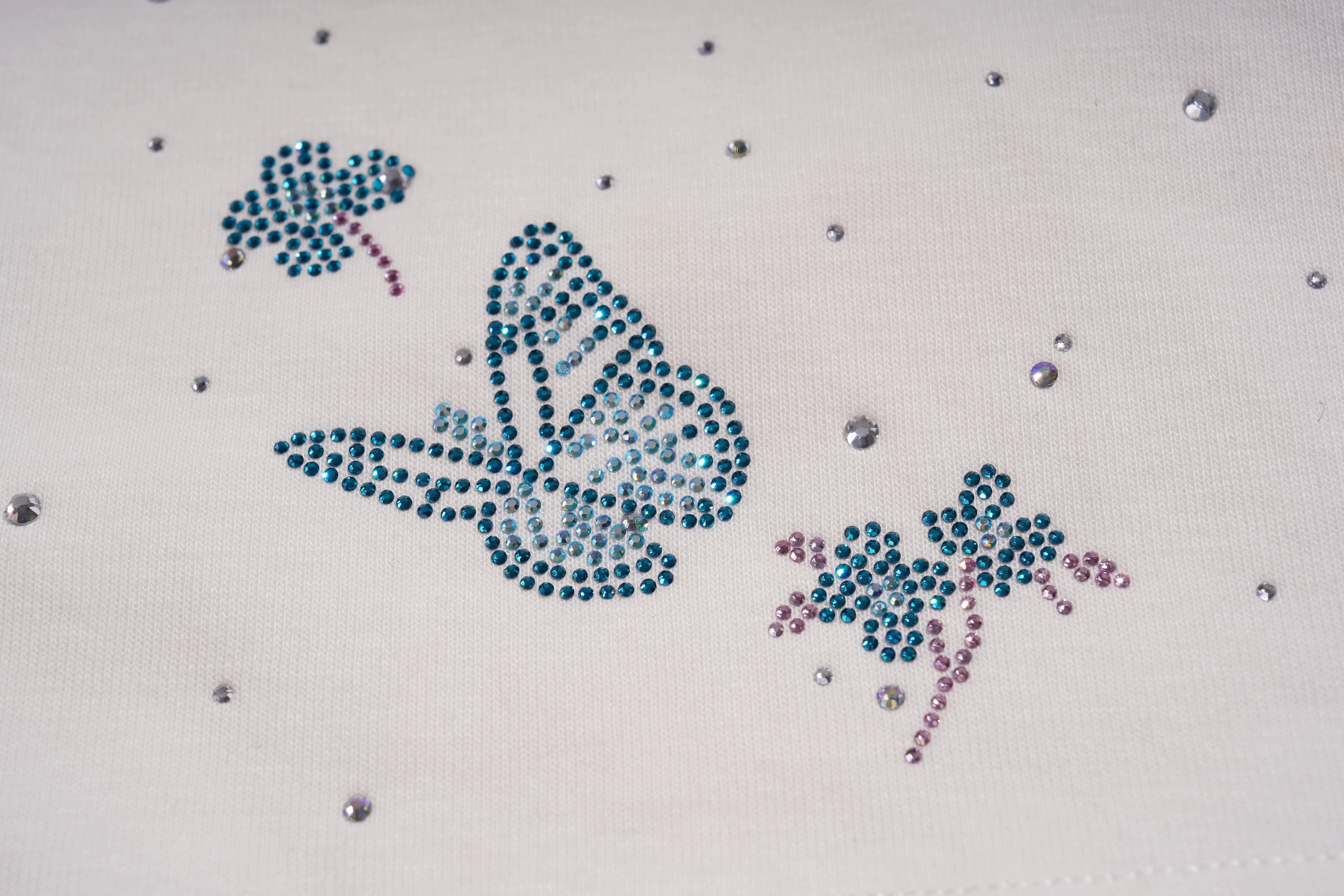 Decorative design with rhinestones on a white fabric background, TCH Starry Gradient Rhinestone Butterfly T-Shirt