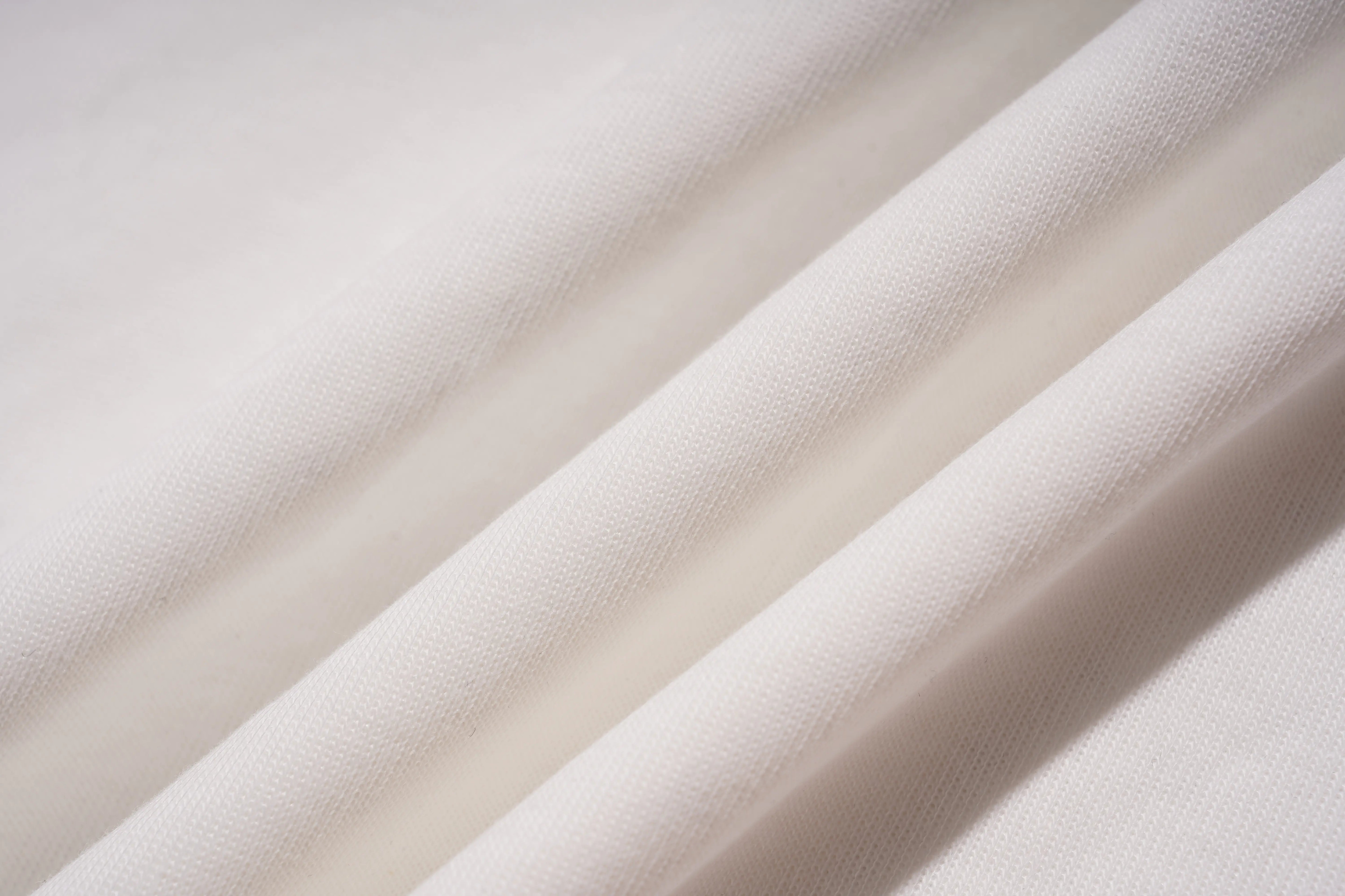Close-up of beige fabric with soft texture, TCH Starry Gradient Rhinestone Butterfly T-Shirt