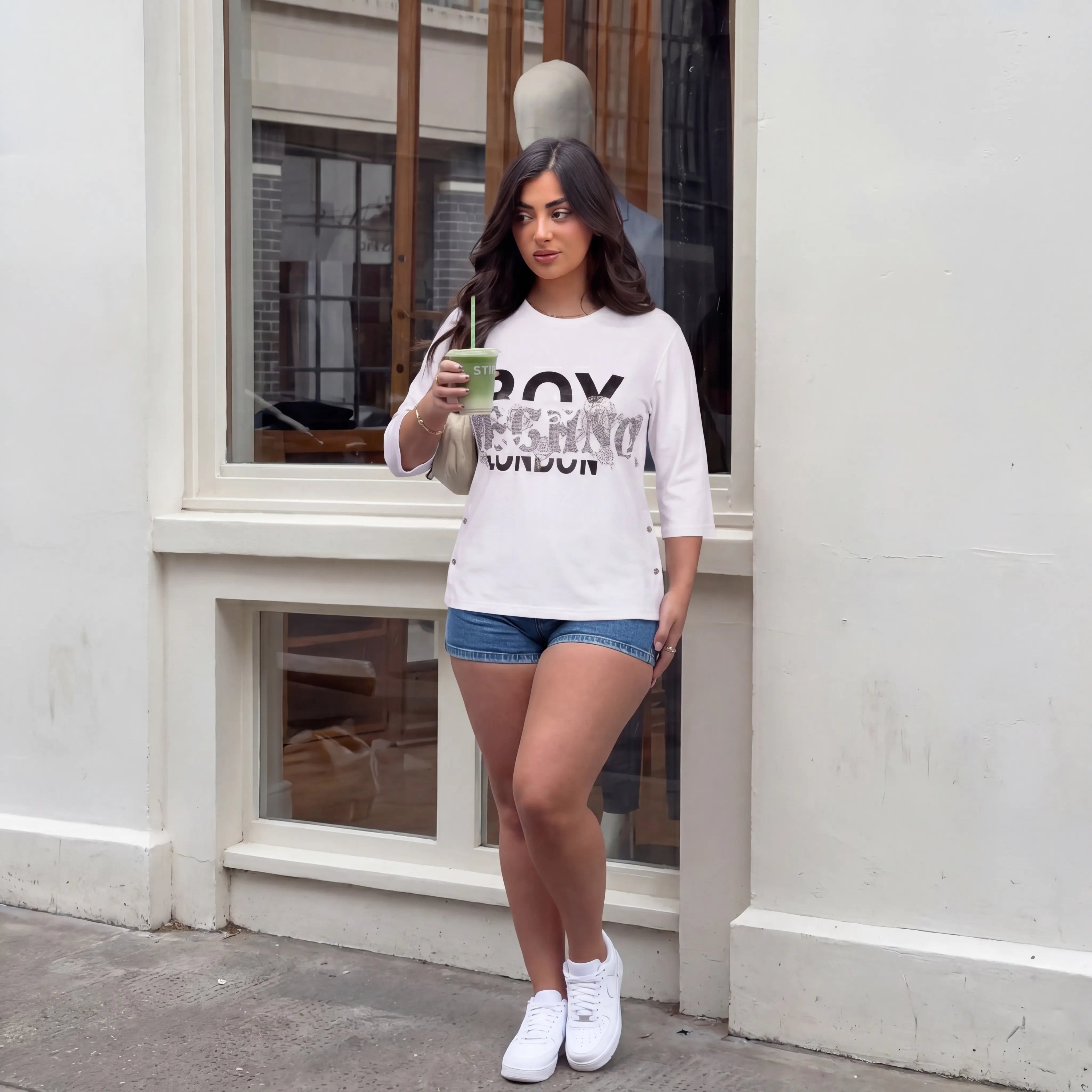 Woman holding a drink in front of a store window, TCH TECHNO Rhinestone Layered Typography T-Shirt
