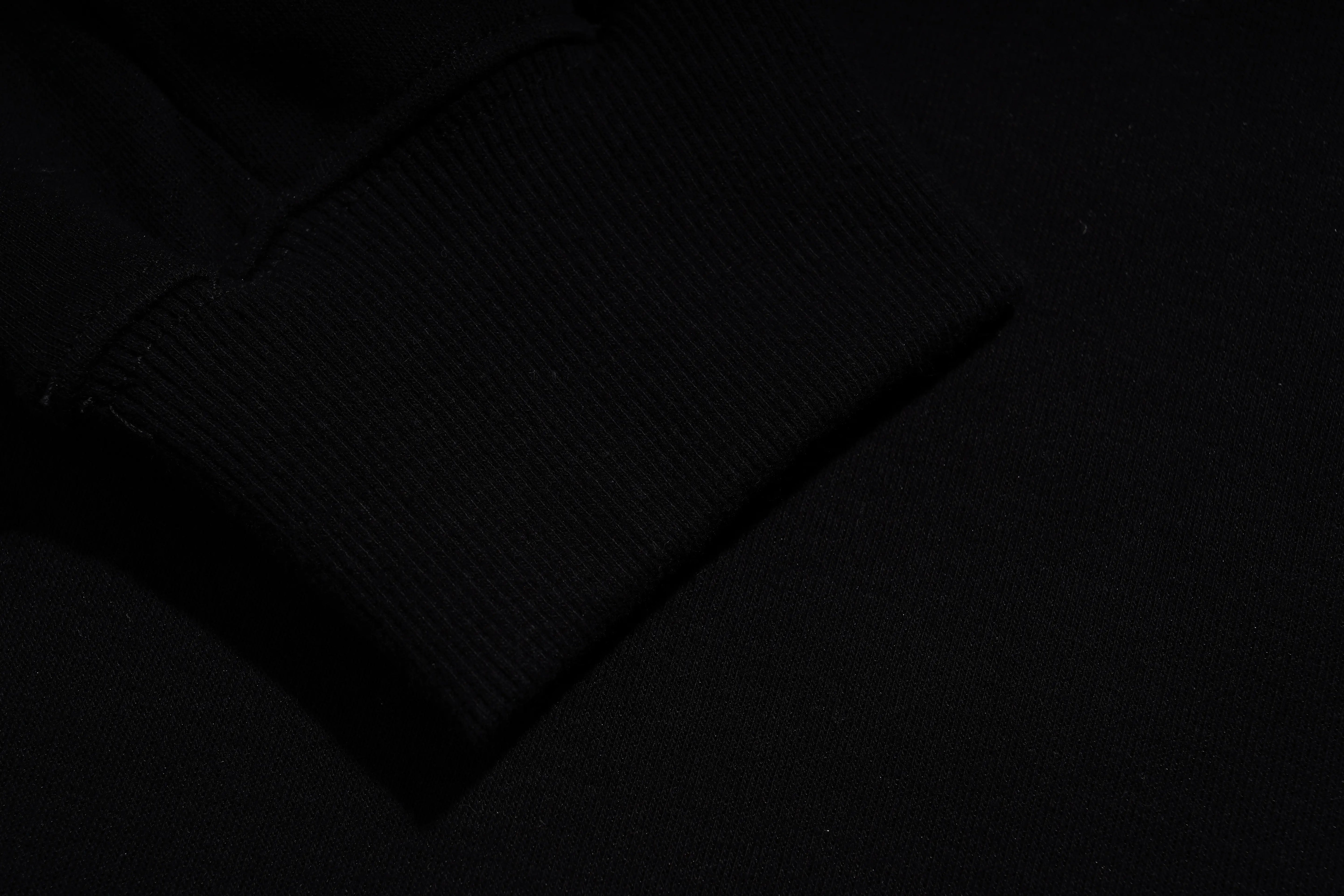 Black textured fabric on a dark background, TCH TECHNO Rhinestone Teddy Sweatshirt